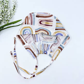 Rainbow Skull tie-back style surgical scrub cap for men by Paradise Caps.