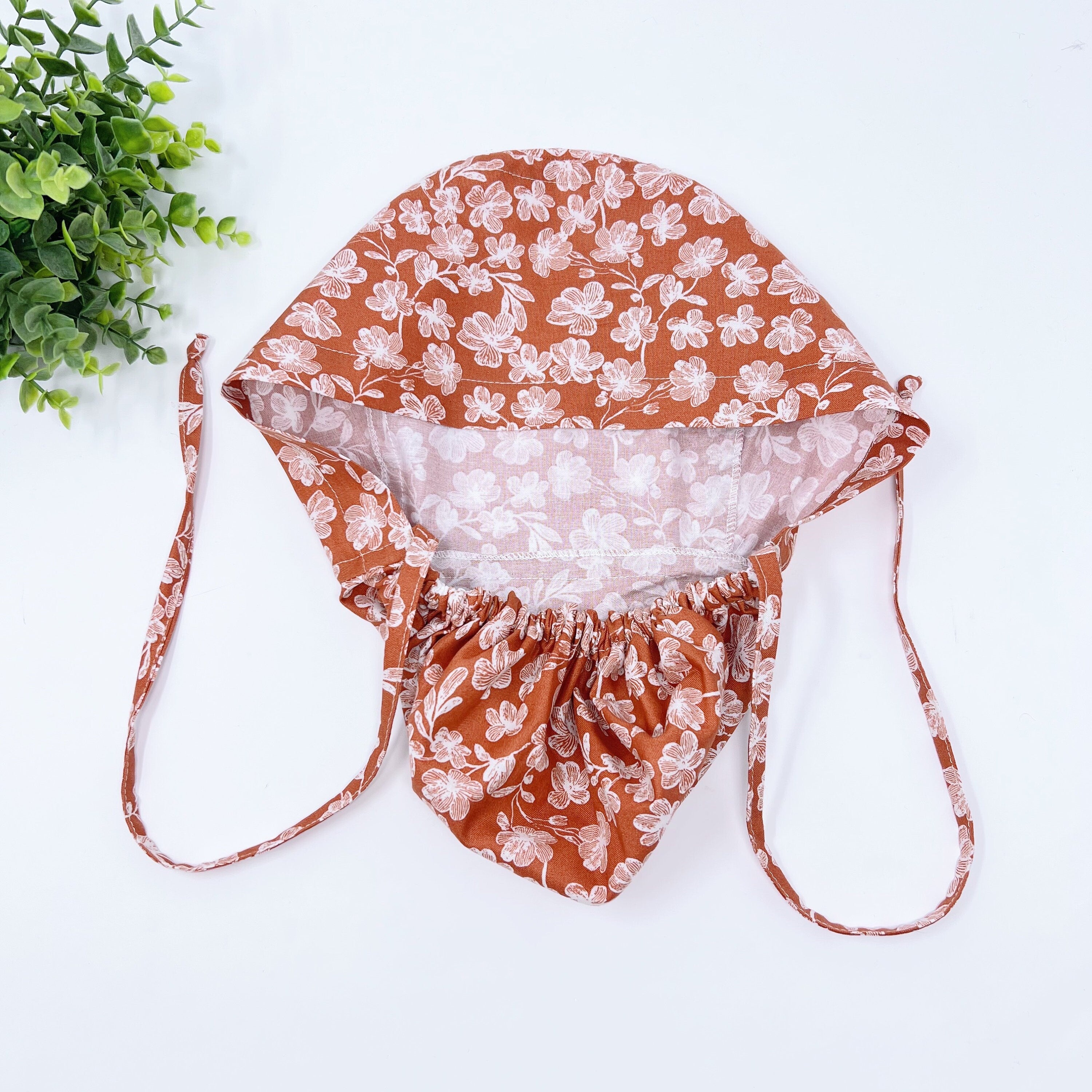 Floral Ponytail scrub cap for women with satin lined option by Paradise Caps.