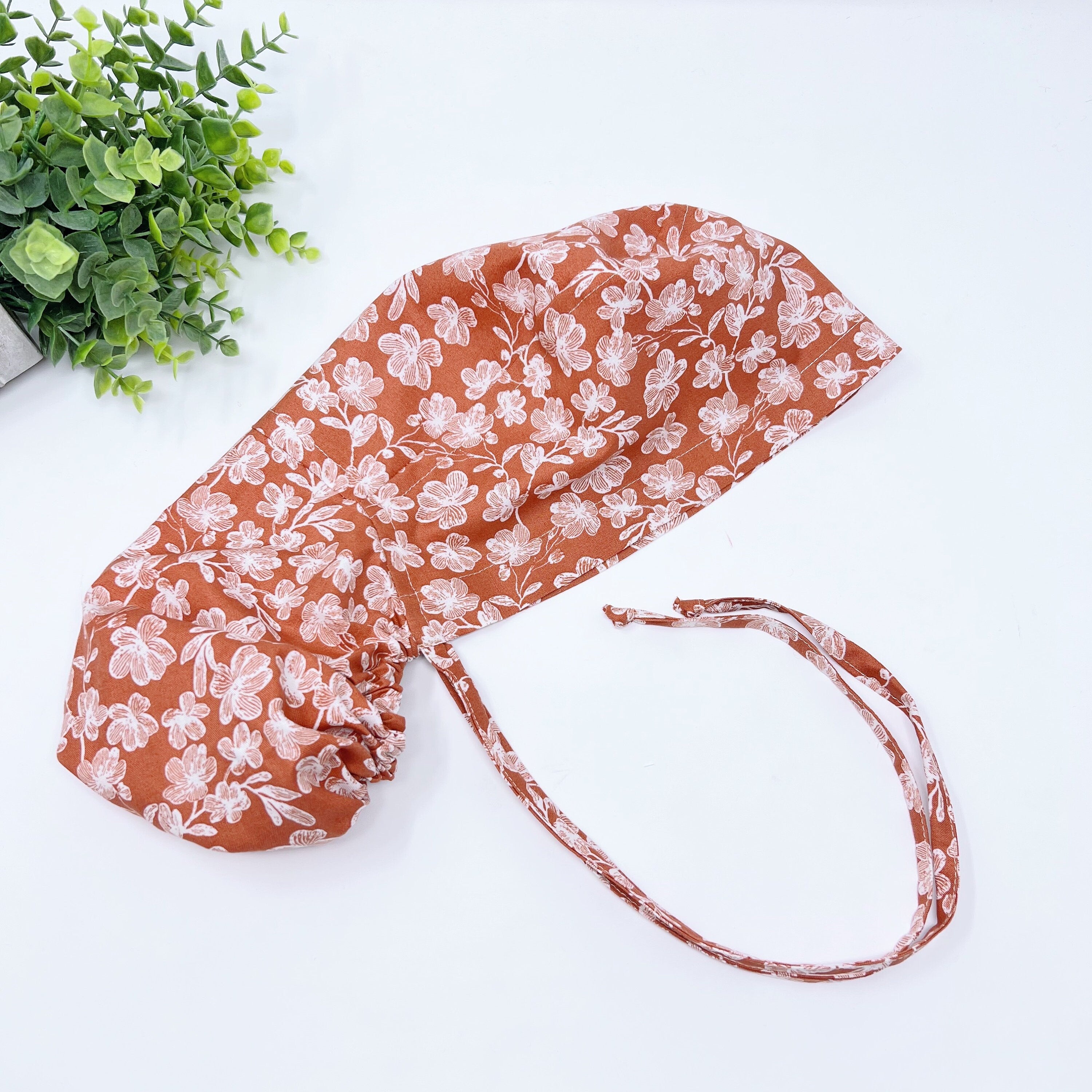 Floral Ponytail scrub cap for women with satin lined option by Paradise Caps.