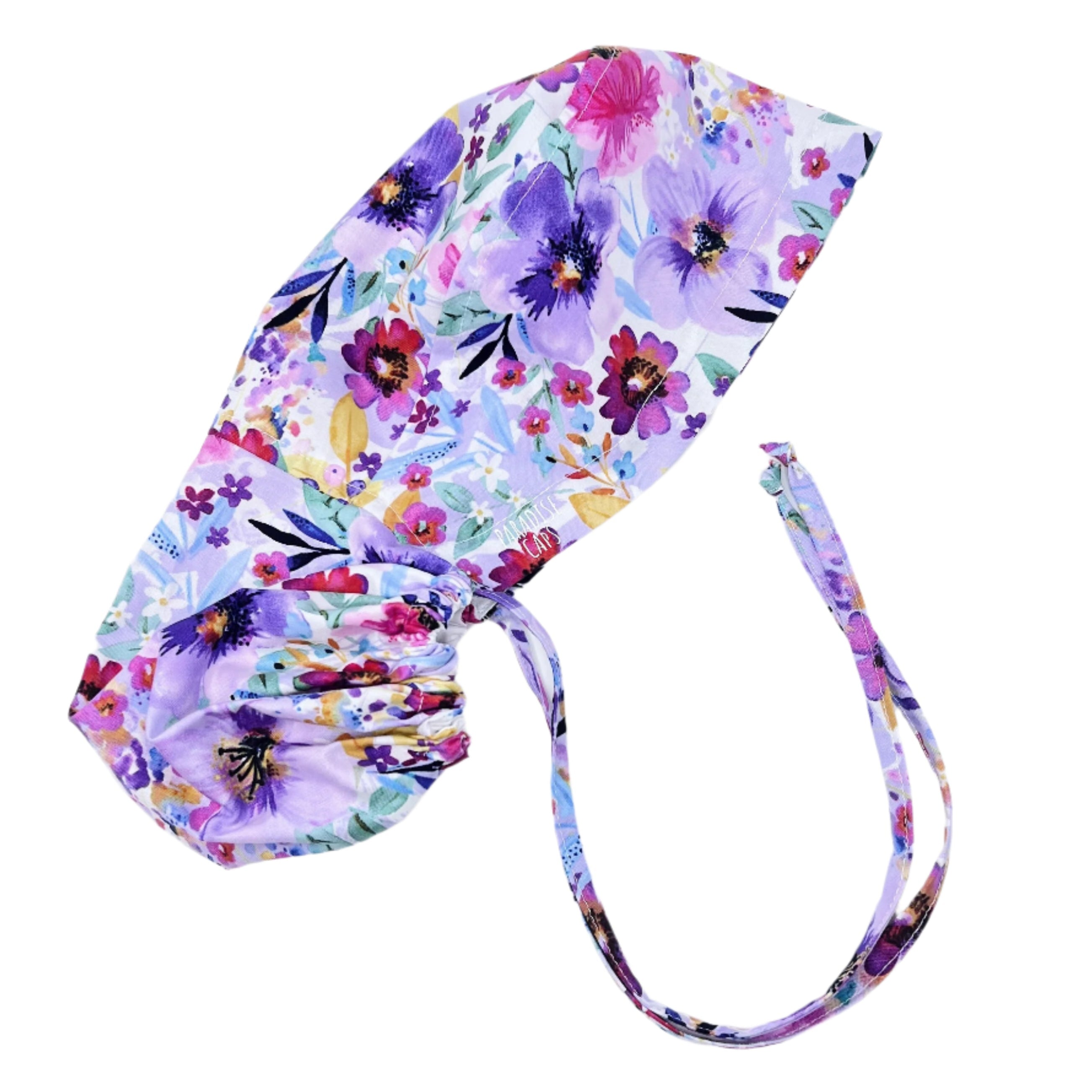 Purple flower Ponytail scrub cap for women with satin lined option by Paradise Caps.