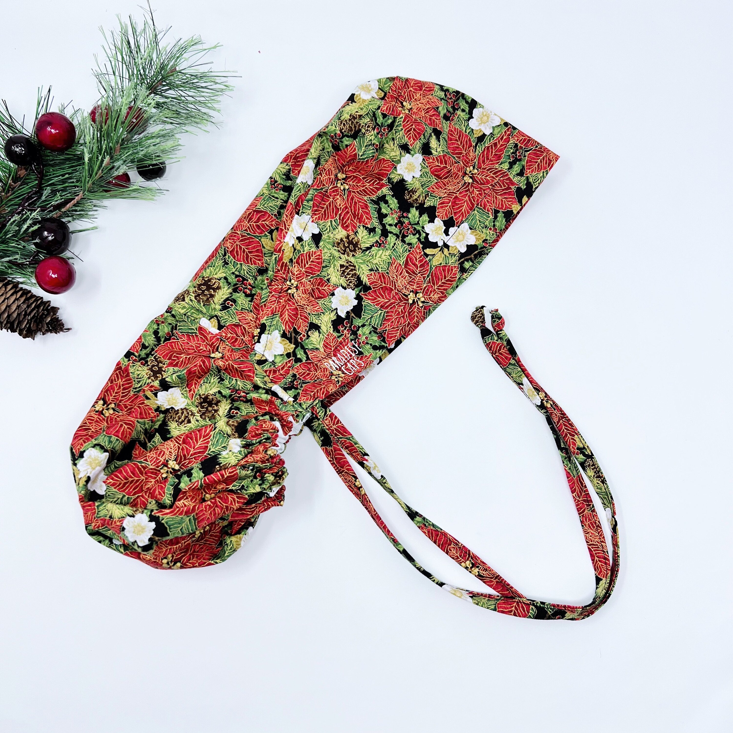 Red Gilded Poinsettias Ponytail scrub cap for women with satin lined option by Paradise Caps.