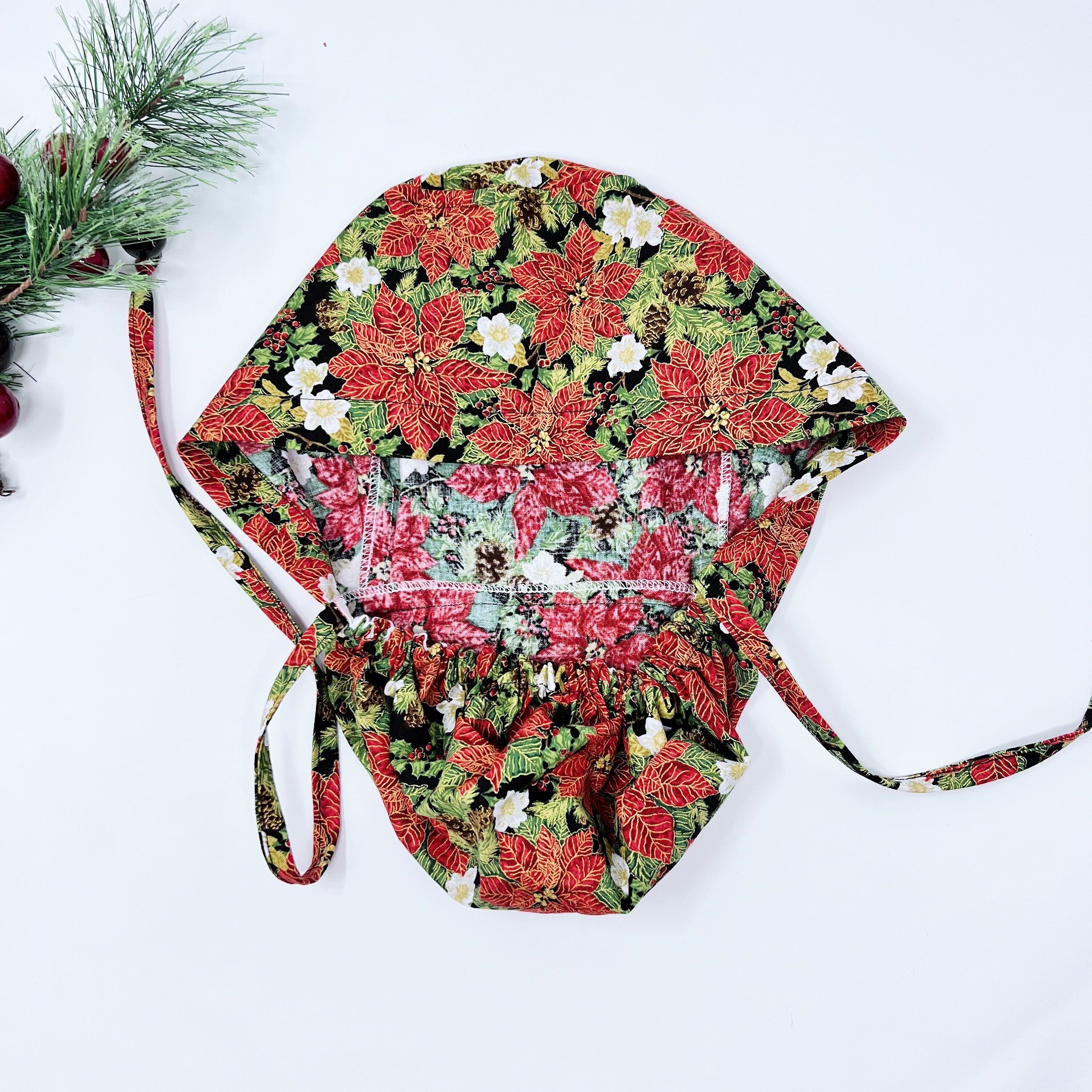 Red Gilded Poinsettias Ponytail scrub cap for women with satin lined option by Paradise Caps.