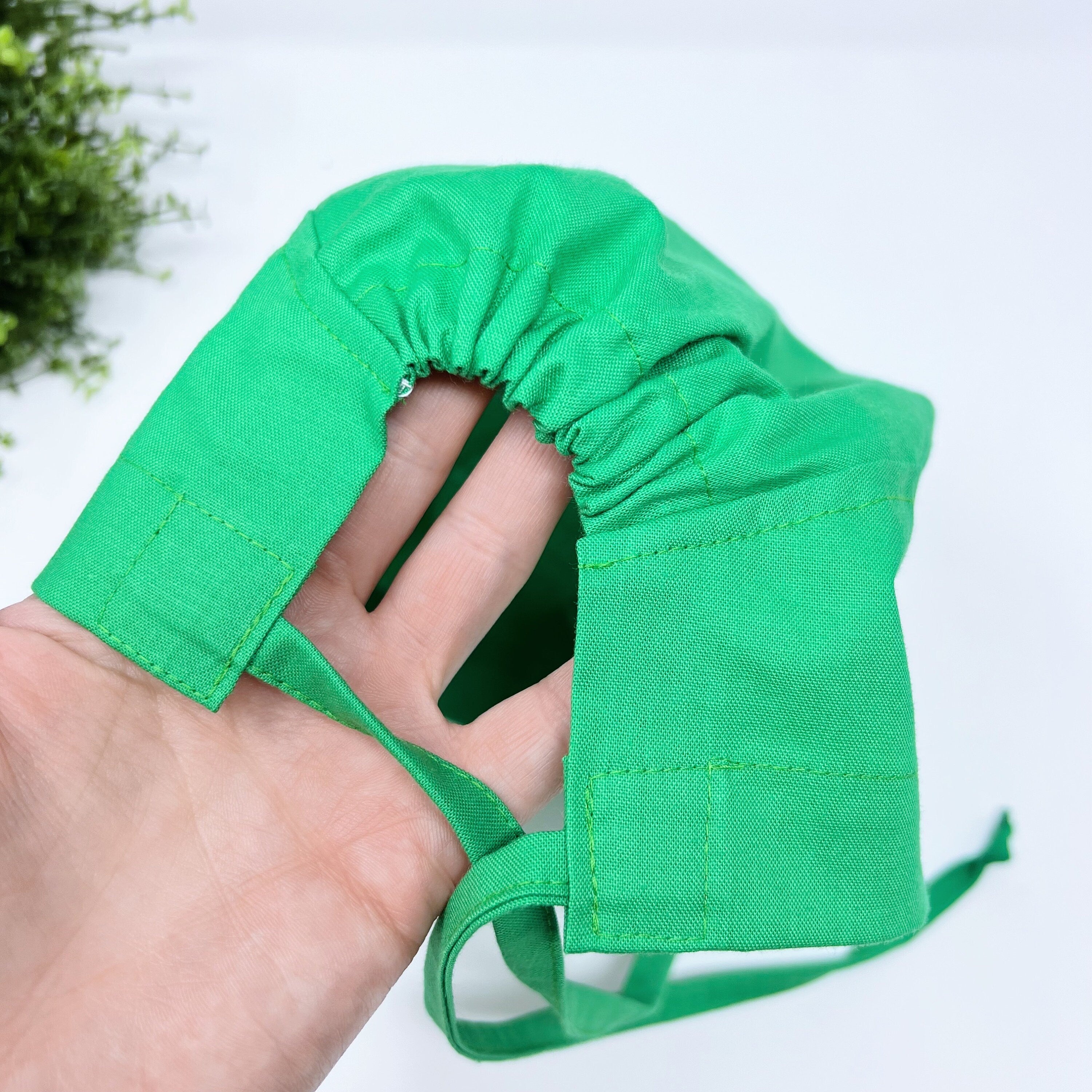 Solid green Skull tie-back style surgical scrub cap by Paradise Caps.