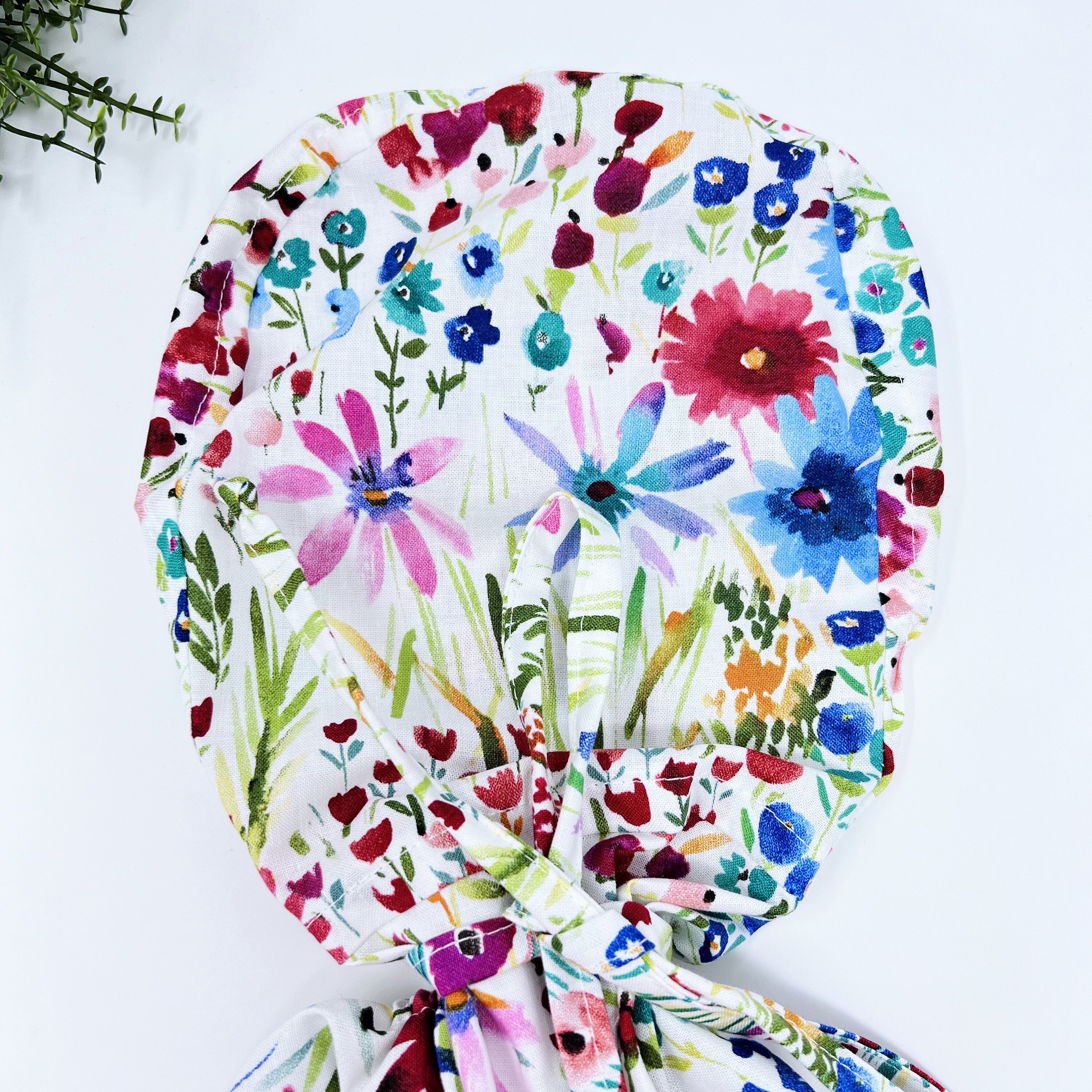 Red Flower Ponytail scrub cap for women with satin lined option by Paradise Caps.