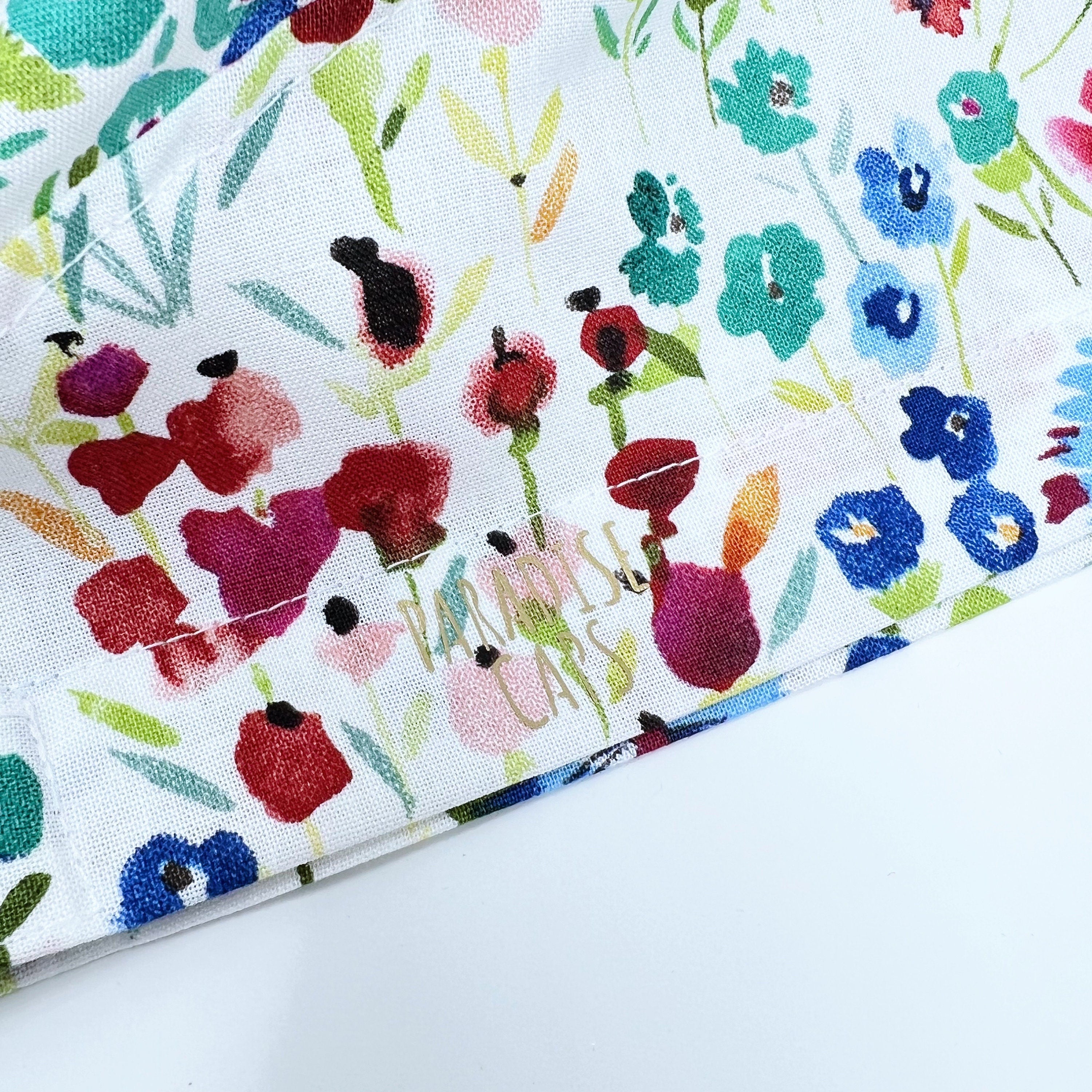 Red Flower Skull tie-back style surgical scrub cap for men by Paradise Caps.