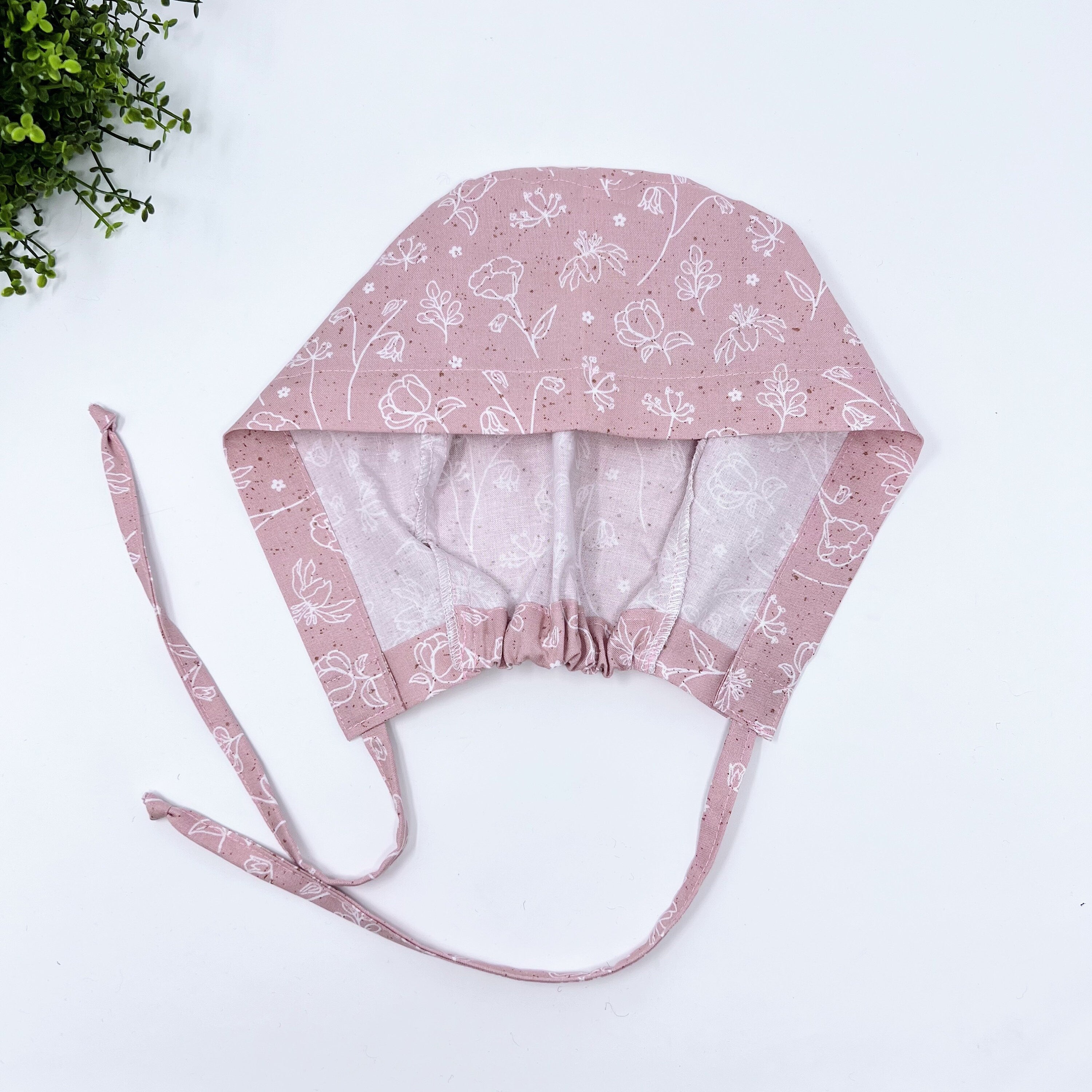 Pink and white Skull tie-back style surgical scrub cap for men by Paradise Caps.