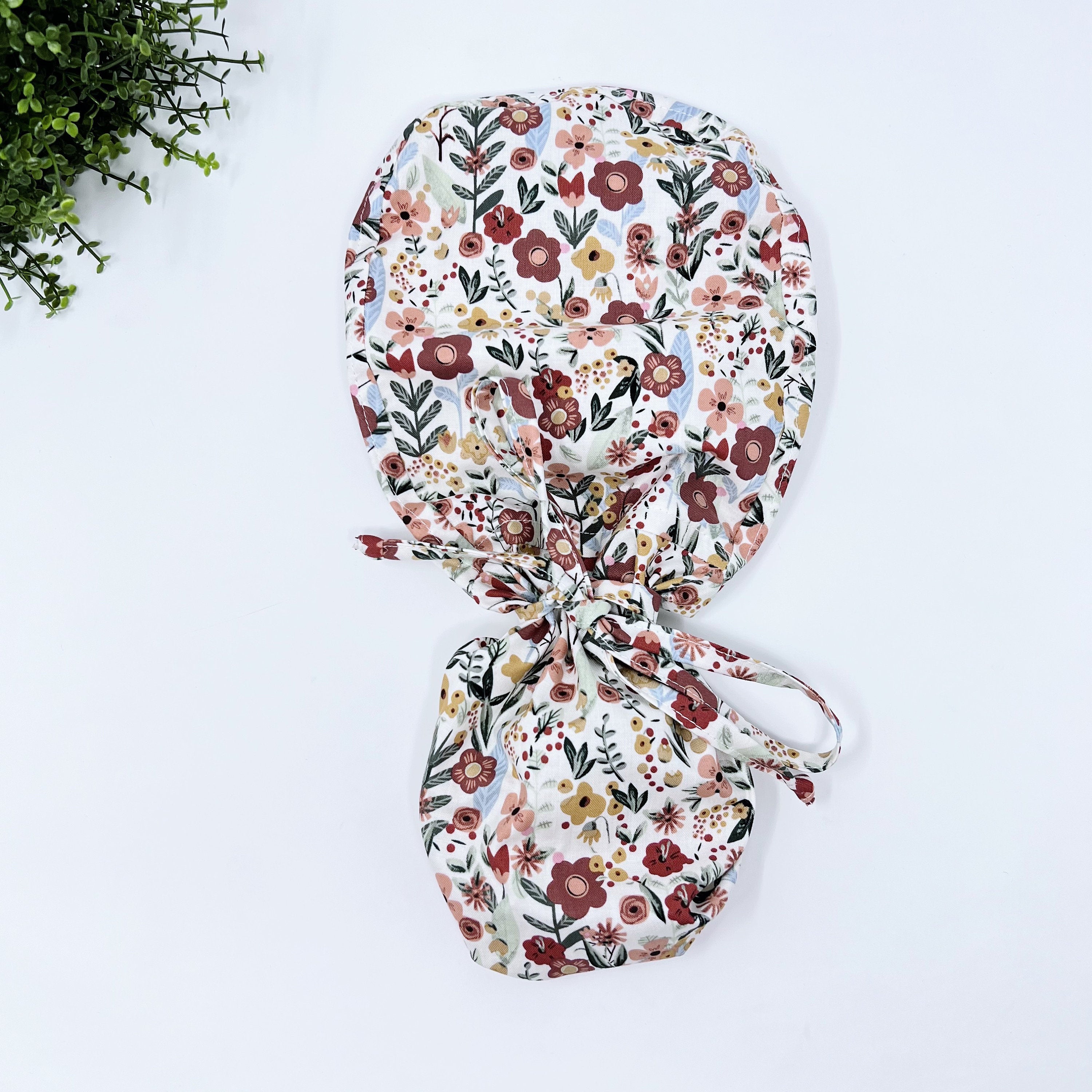 Floral Ponytail scrub cap for women with satin lined option by Paradise Caps.
