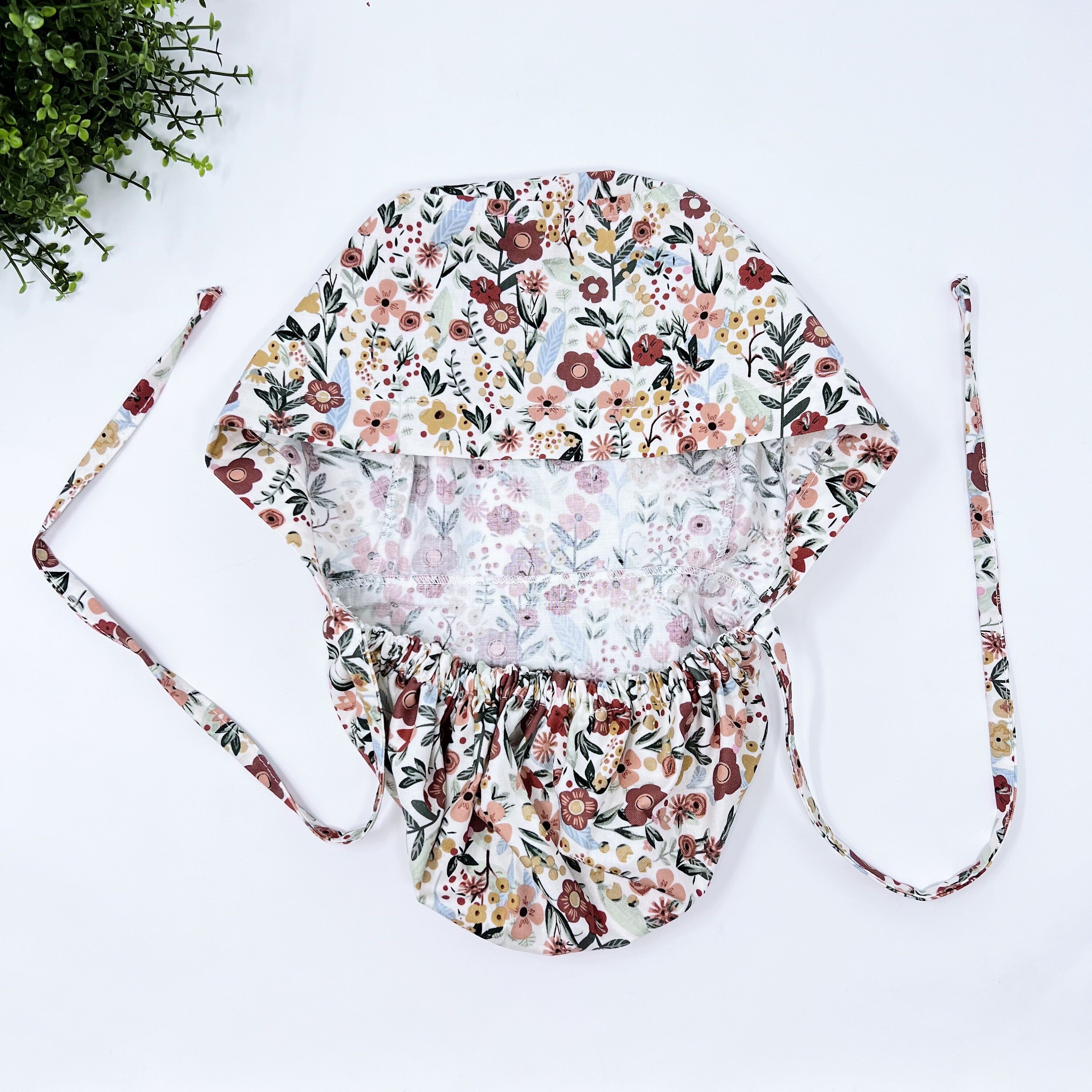 Floral Ponytail scrub cap for women with satin lined option by Paradise Caps.