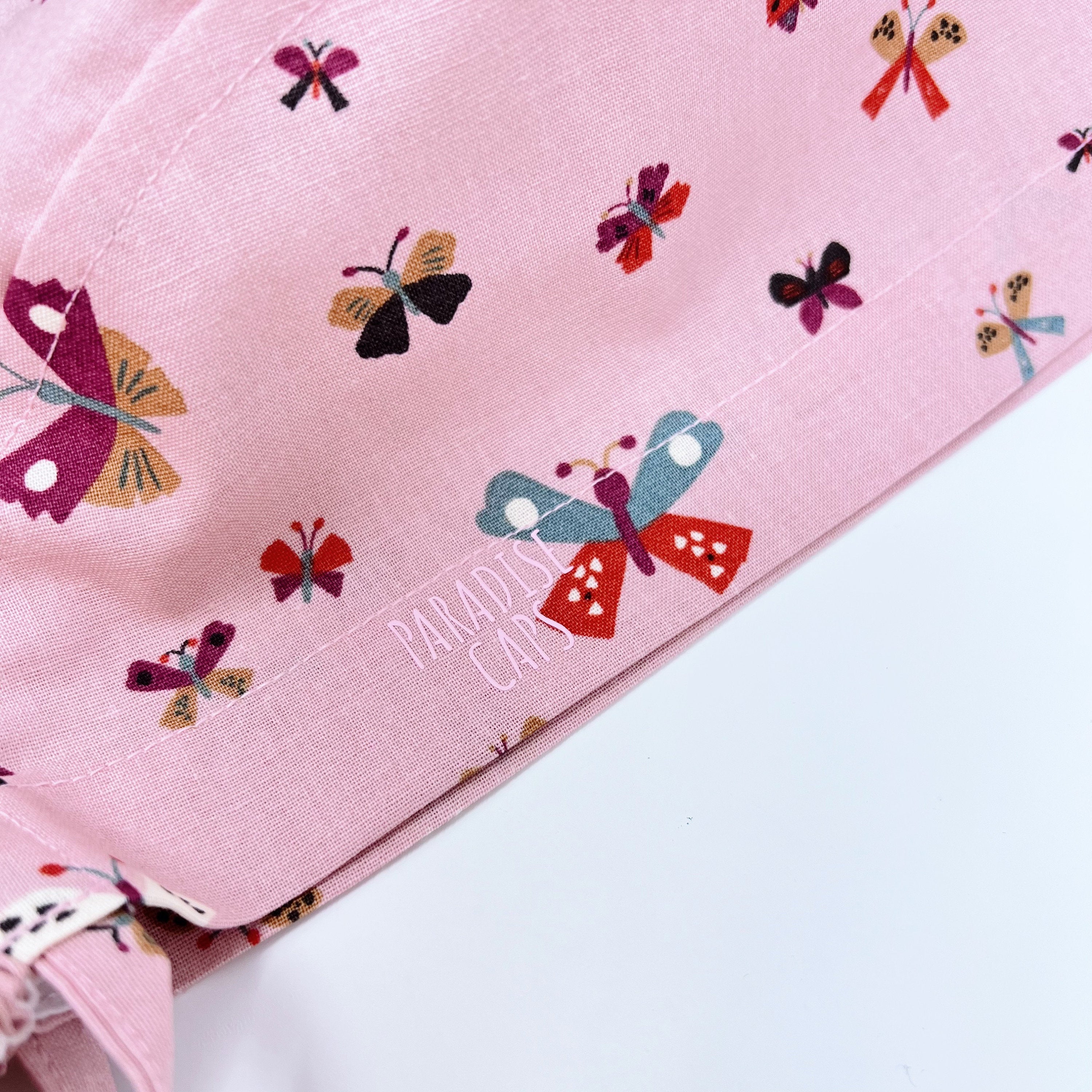 Butterflies Ponytail scrub cap for women with satin lined option by Paradise Caps.