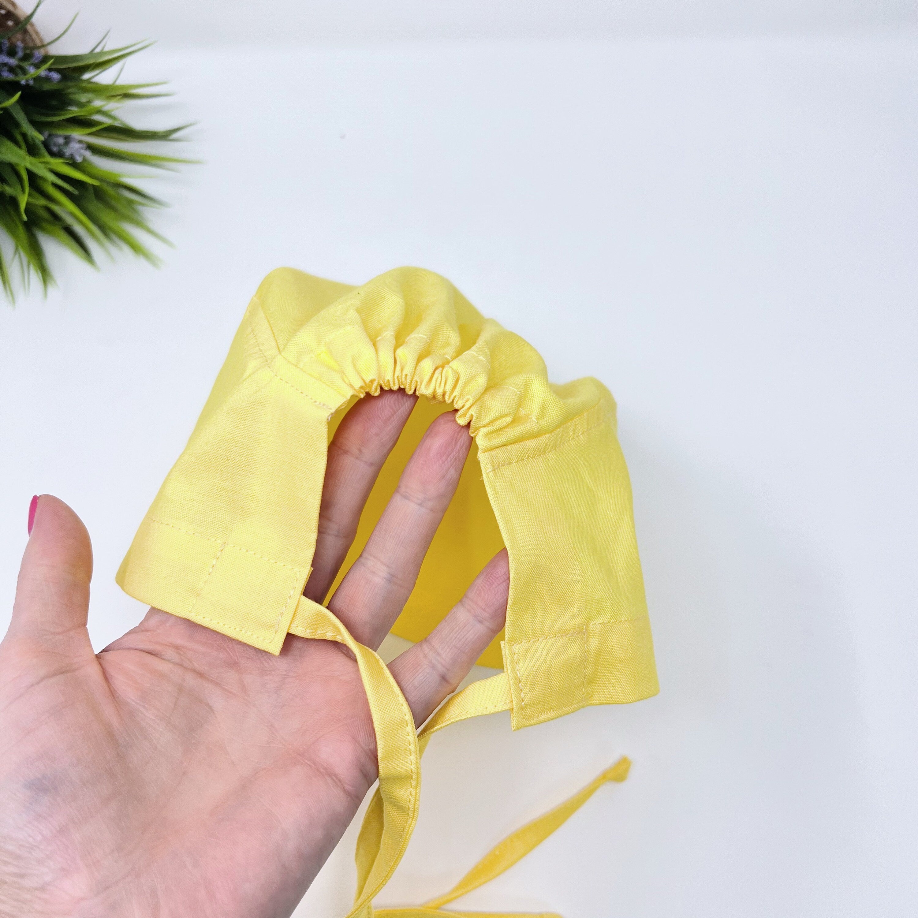 Solid yellow Skull tie-back style surgical scrub cap by Paradise Caps.