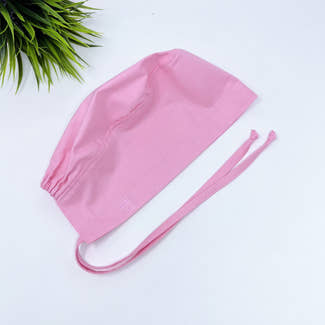 Solid pink Skull tie-back style surgical scrub cap for men by Paradise Caps.