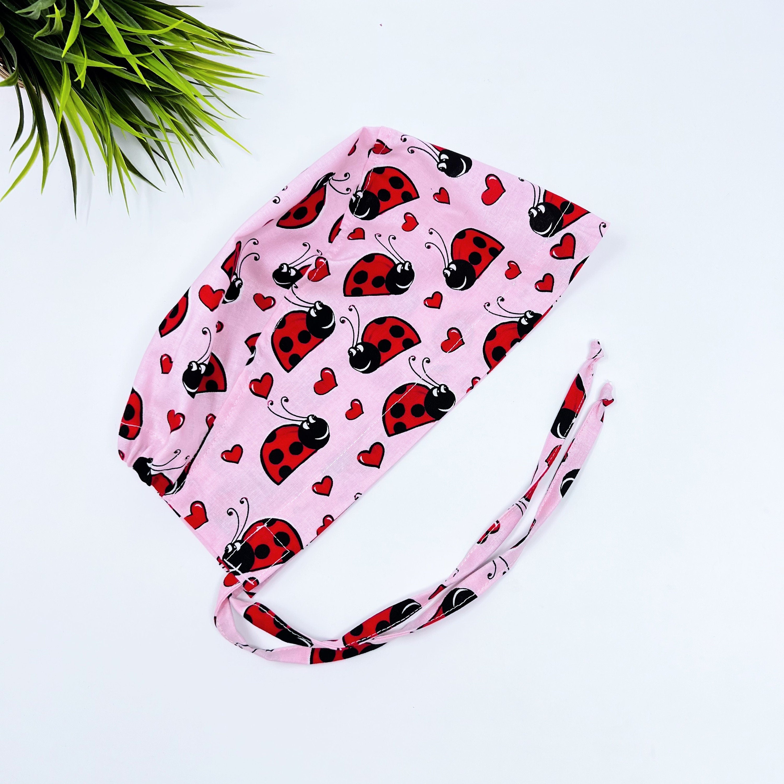 Ladybug Skull tie-back style surgical scrub cap by Paradise Caps.
