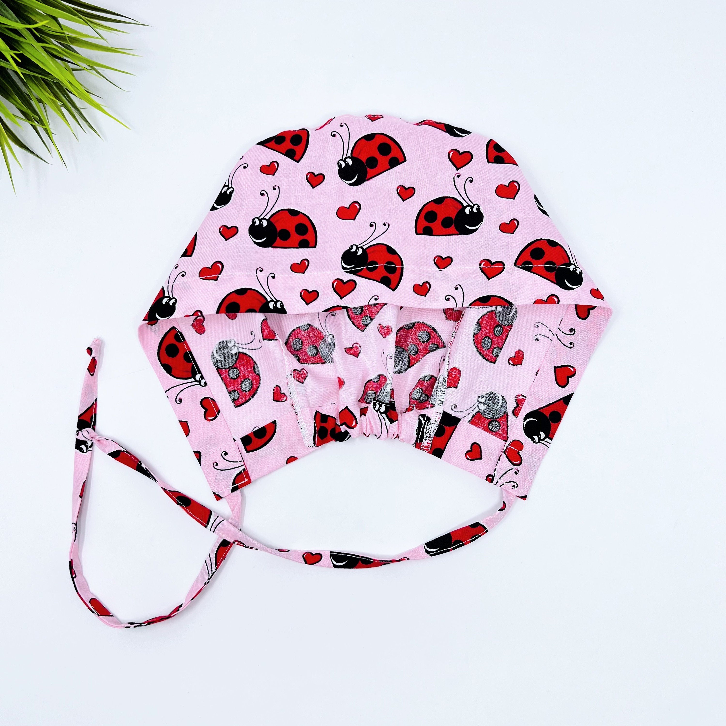 Ladybug Skull tie-back style surgical scrub cap by Paradise Caps.