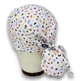 Ponytail surgical scrub cap for women. Spring Petals Scrub hat for women with satin lined option by Paradise Caps.