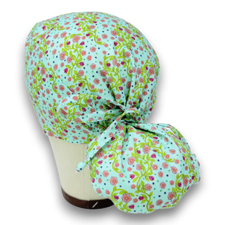 Pink flower Ponytail scrub cap for women with satin lined option by Paradise Caps.