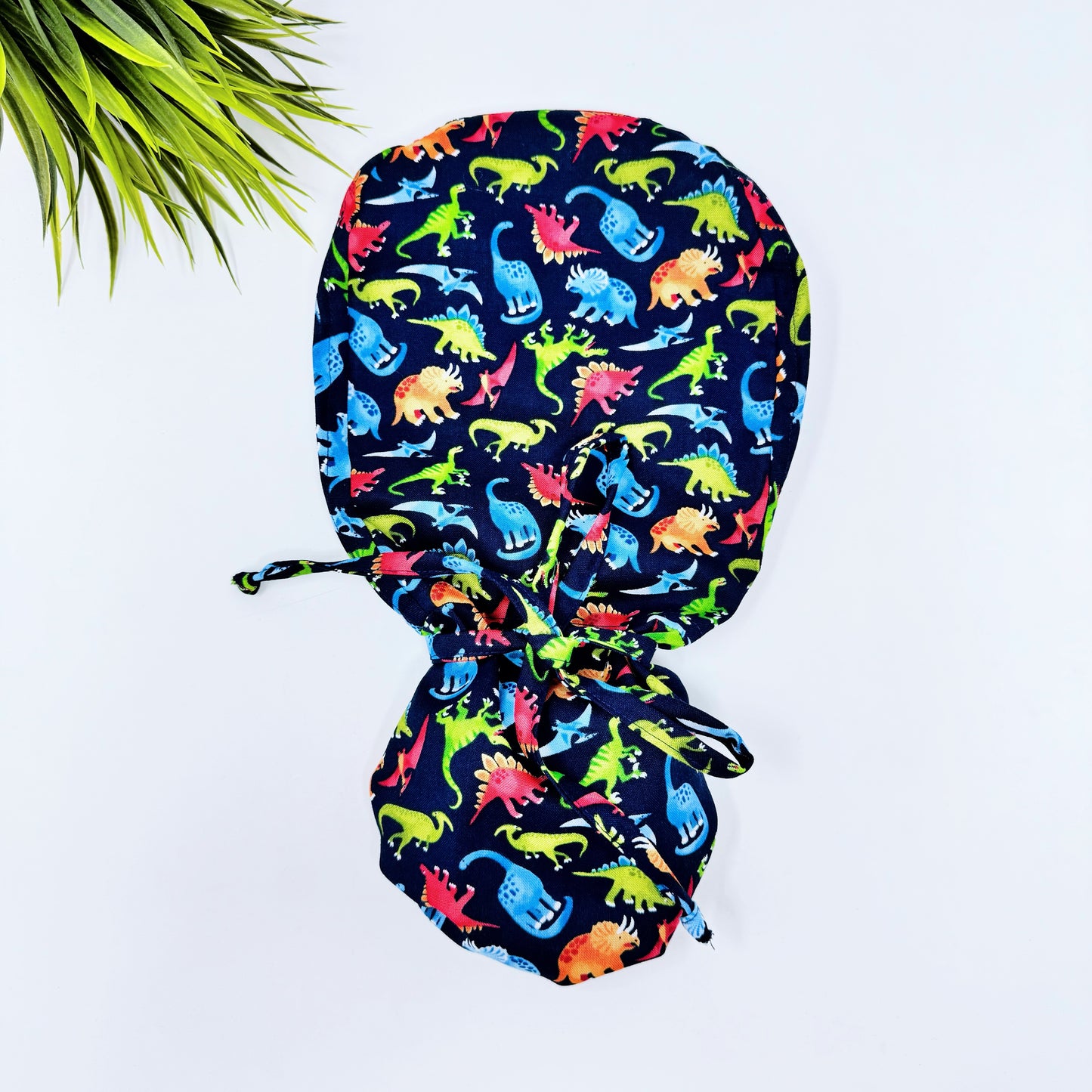 Fashion Dinosaurs Ponytail scrub cap, Surgical cap women. Satin Lined Option Surgical cap with ponytail.