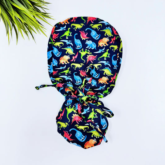 Fashion Dinosaurs Ponytail scrub cap, Surgical cap women. Satin Lined Option Surgical cap with ponytail.