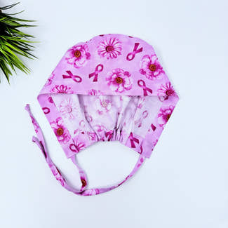 Pink Flower Skull tie-back style surgical scrub cap for men by Paradise Caps.