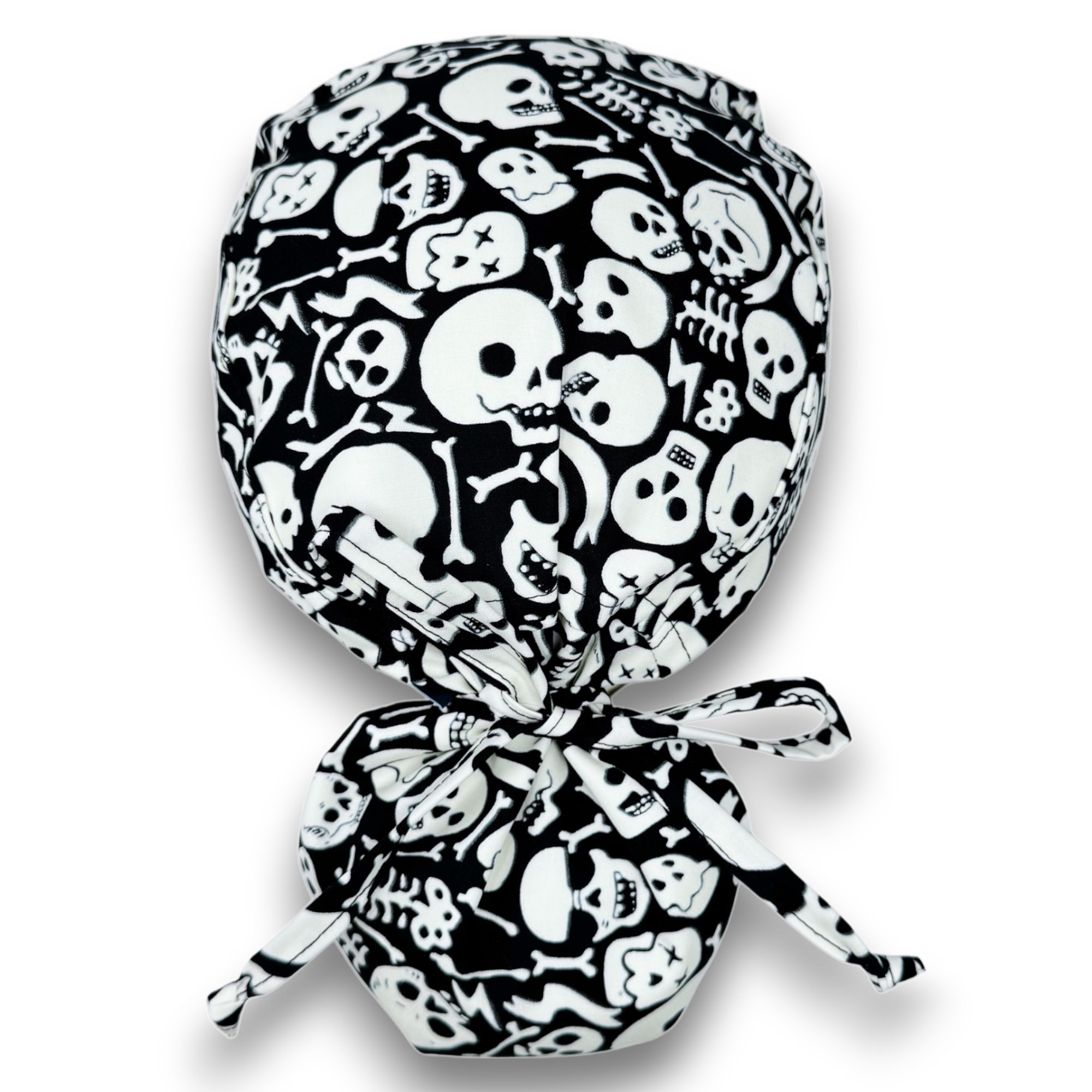 Glow Tossed Skulls Ponytail scrub cap for women with satin lined option by Paradise Caps. Glows in the Dark!