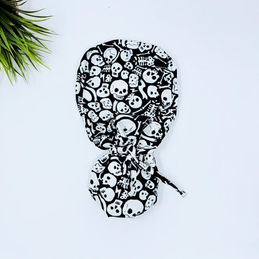 Glow Tossed Skulls Ponytail scrub cap, Halloween Surgical cap women. Satin Lined Option Surgical cap with ponytail.