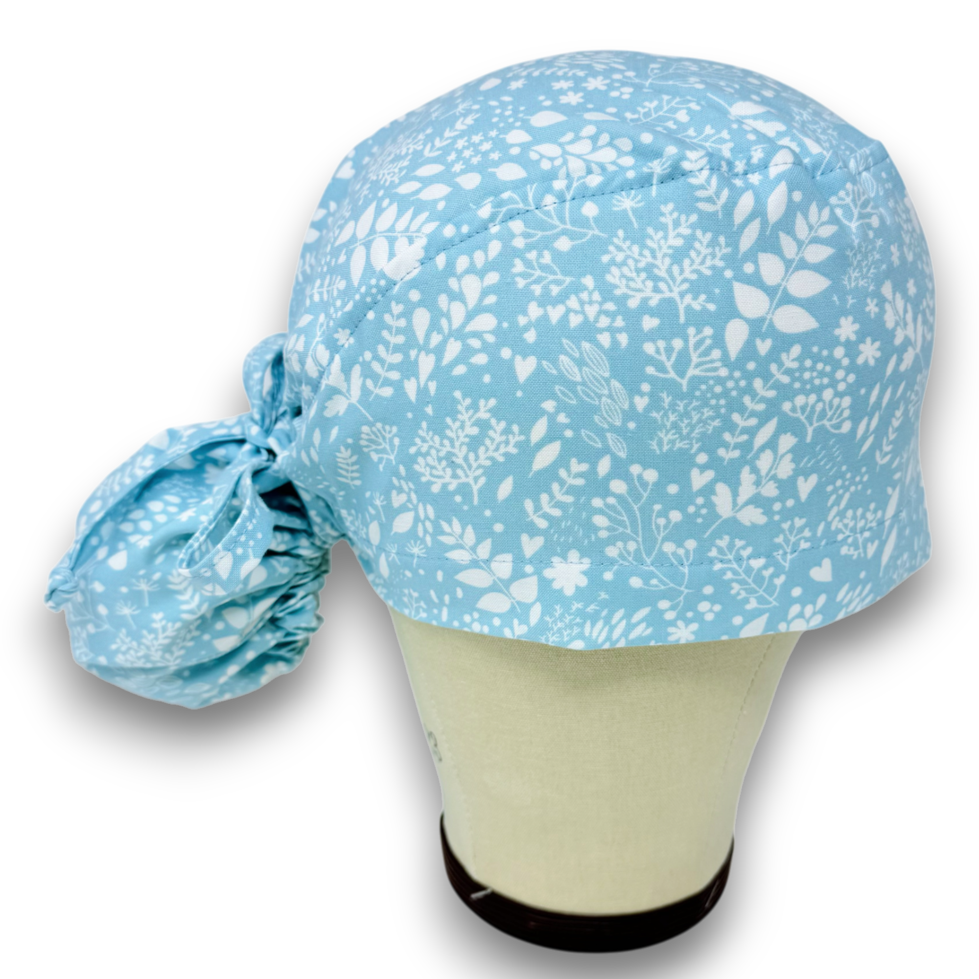 Light Blue Floral Ponytail scrub cap for women with satin lined option by Paradise Caps.
