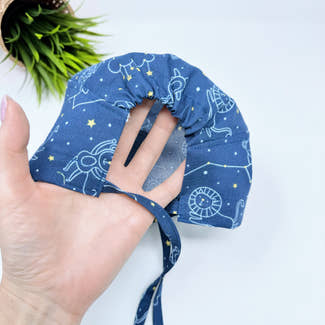 Navy Constellations Skull tie-back style surgical scrub cap for men by Paradise Caps.