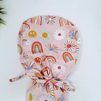 Rainbows Ponytail scrub cap for women with satin lined option by Paradise Caps.