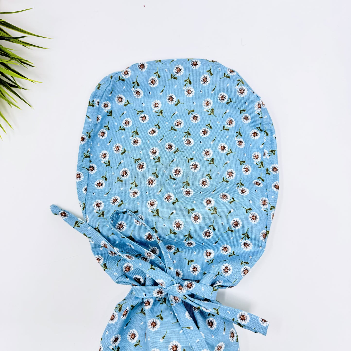 Tossed DaisIes Blue Ponytail scrub cap, Surgical cap women. Satin Lined Option Surgical cap with ponytail.