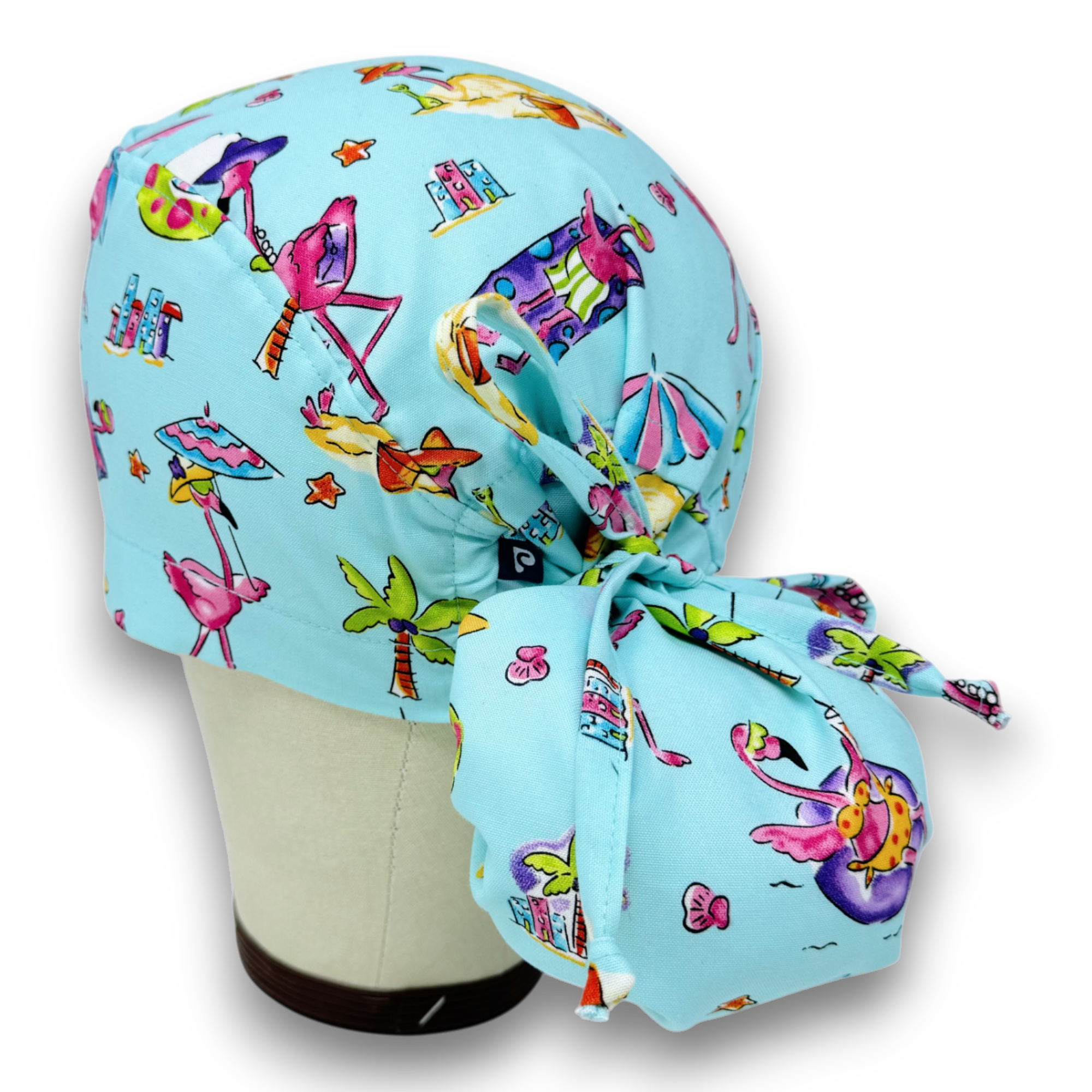 Flamingo Ponytail scrub cap for women with satin lined option by Paradise Caps.