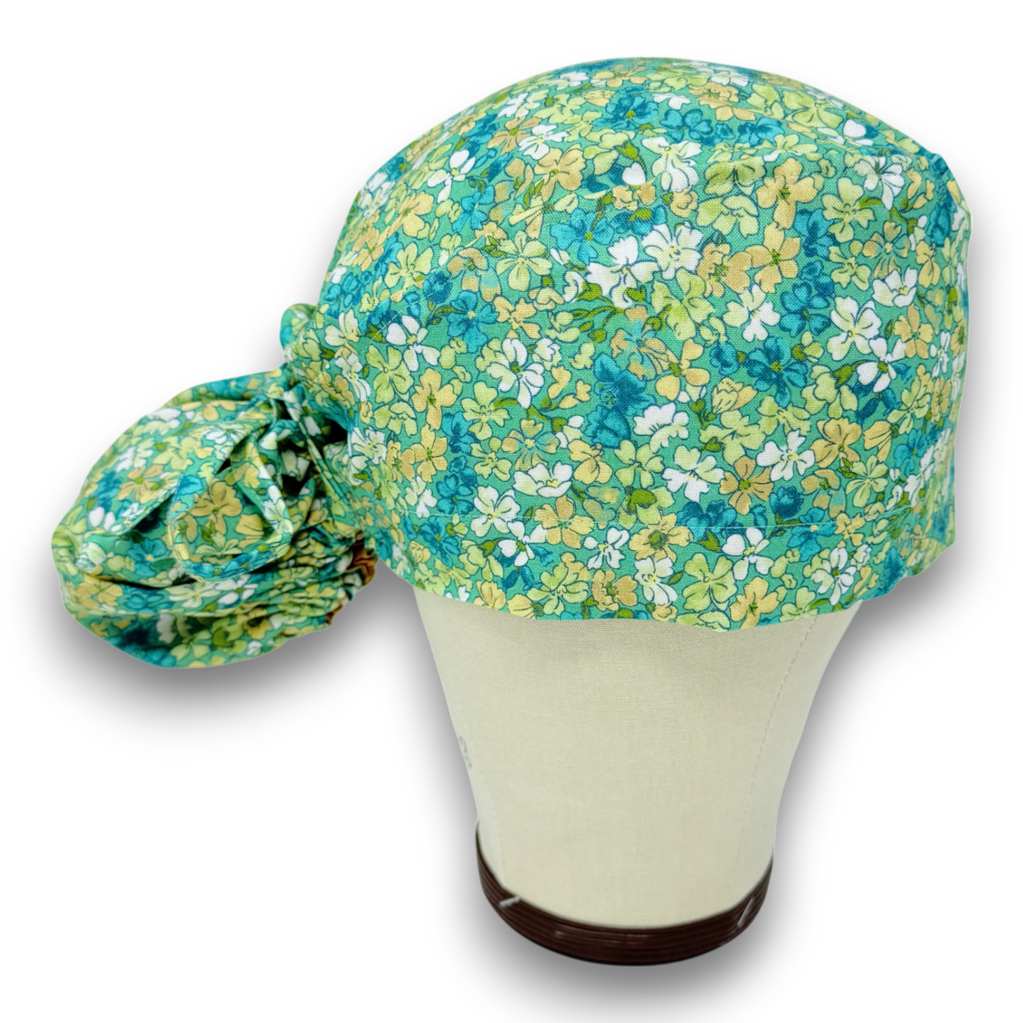 Aqua Flora Ponytail scrub cap for women with satin lined option by Paradise Caps.