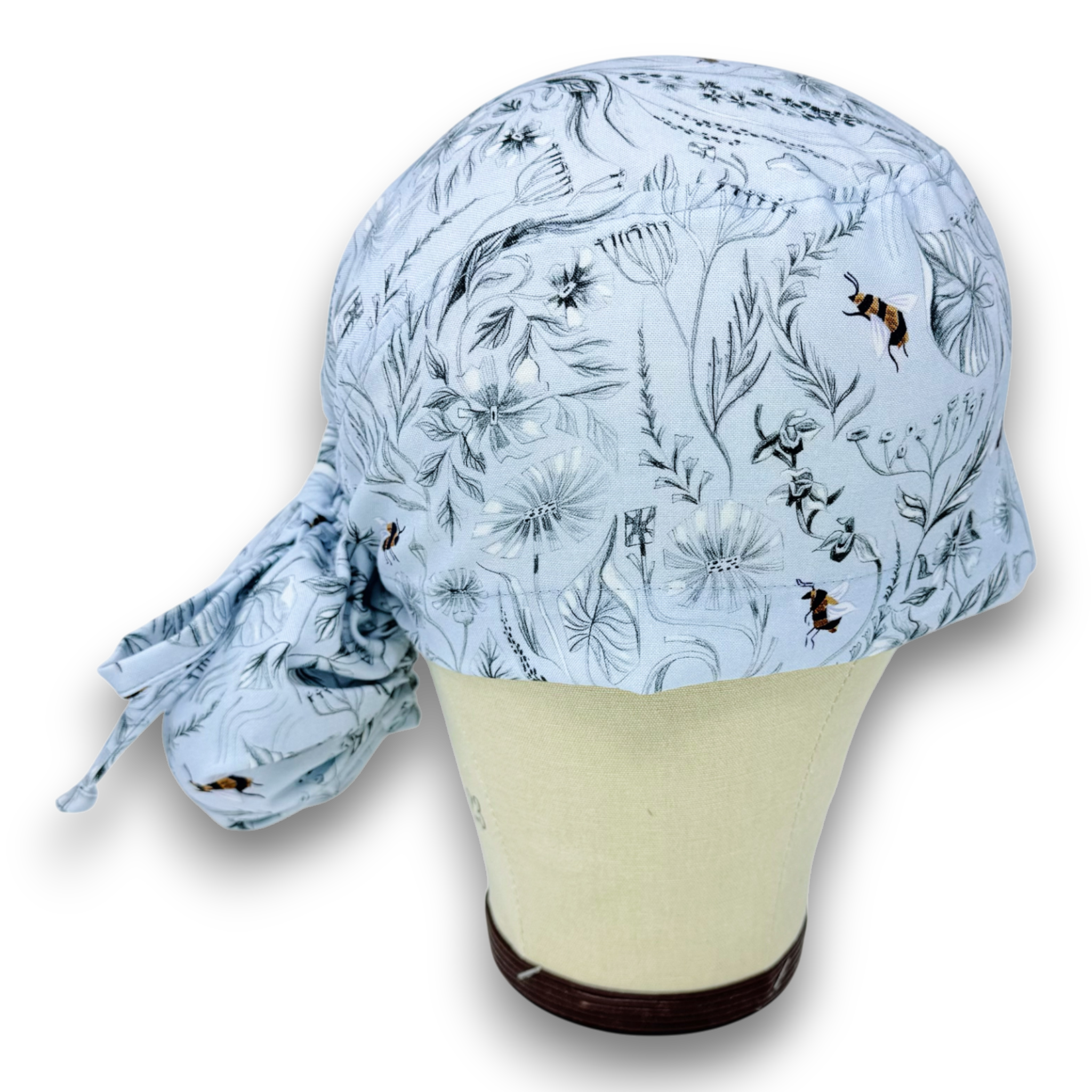 Glacier Pollinators Ponytail scrub cap for women with satin lined option by Paradise Caps.