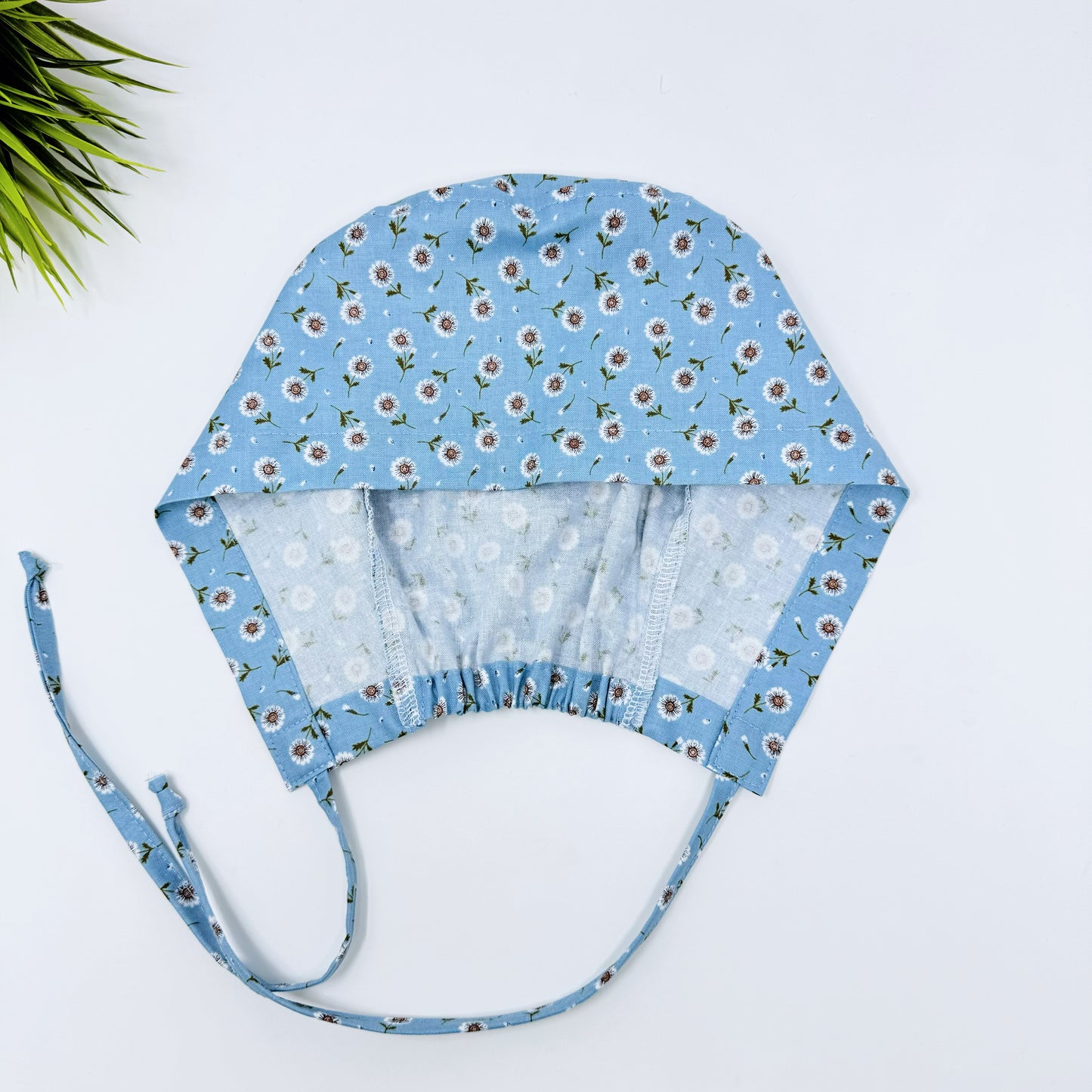 Tossed DaisIes Blue regular surgical cap. Scrub caps for women and men.