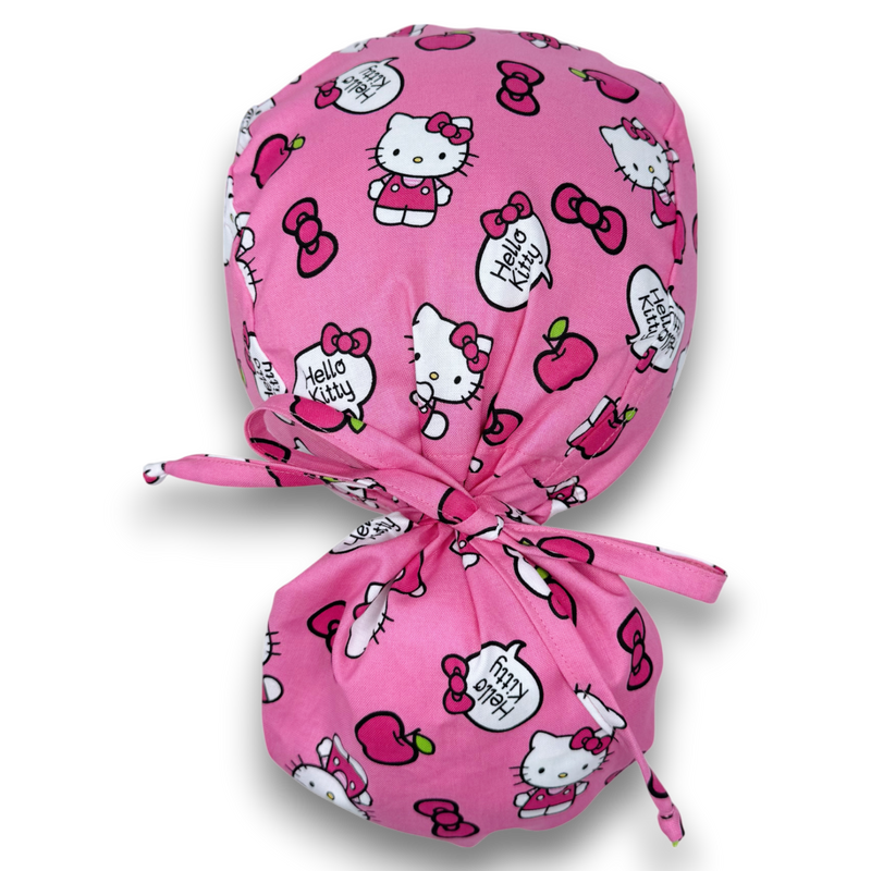 Pink cartoon-print Ponytail scrub cap with a back pouch and matching fabric ties