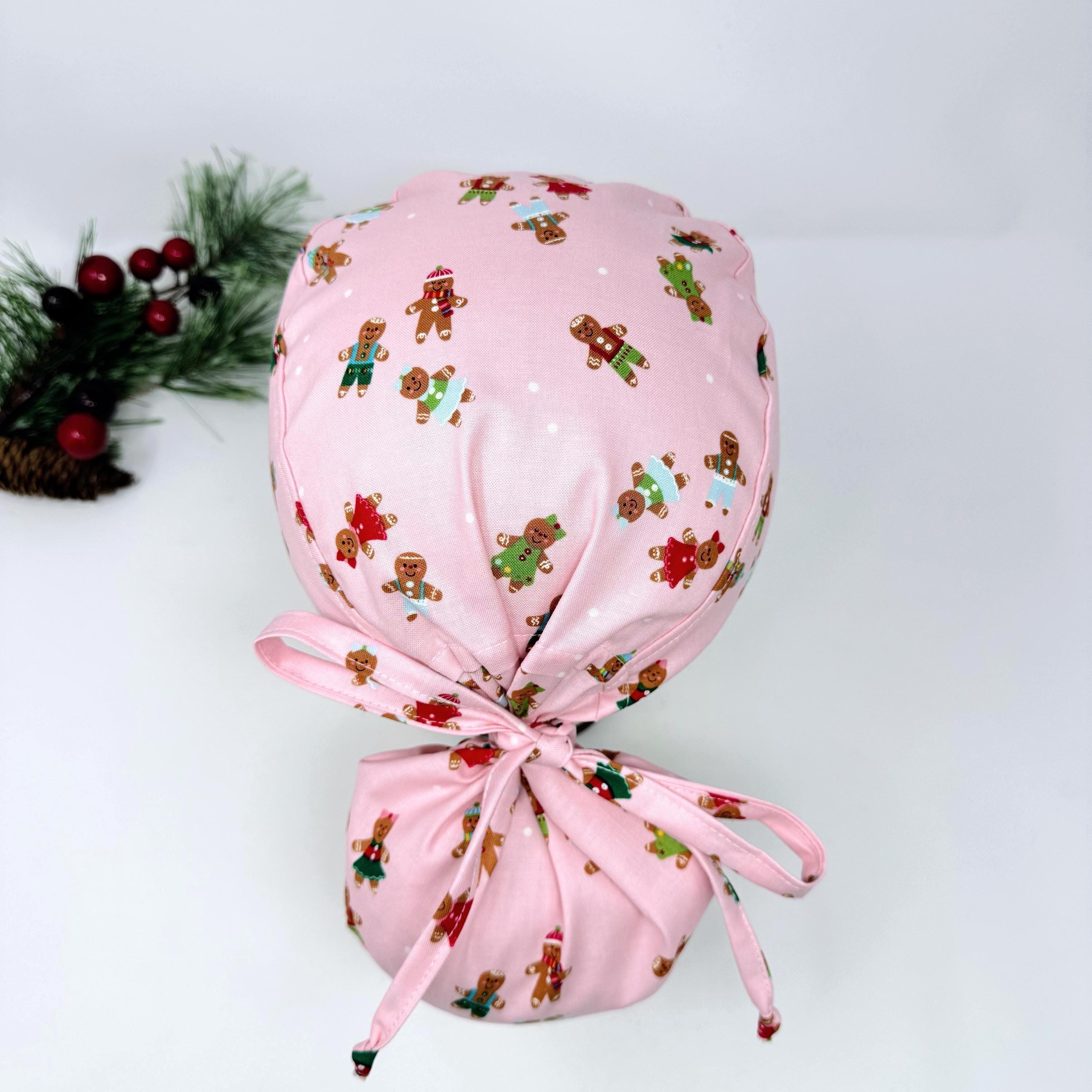 Gingerbread Ponytail scrub cap with Satin Lined. Cute Christmas surgical scrub hats for women by Paradise Caps. Pink
