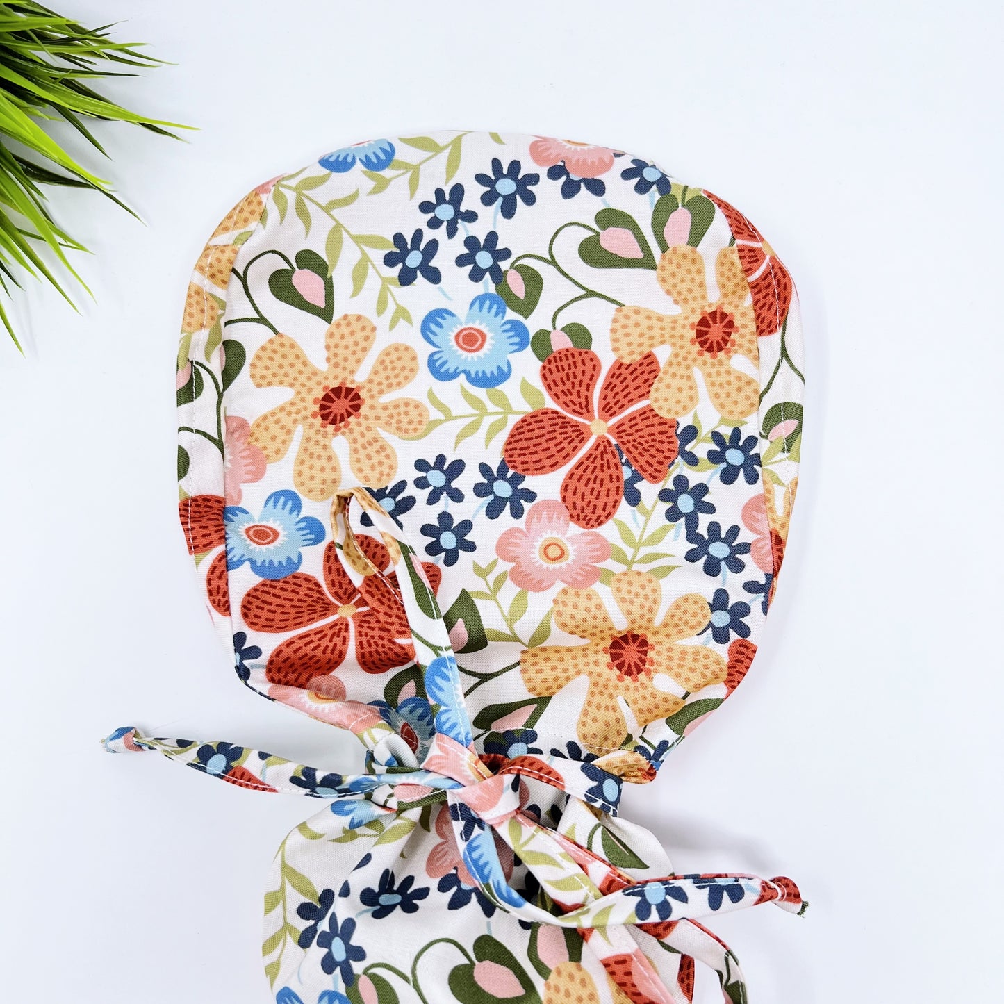 Embroidered flowerbed Ponytail scrub cap, Surgical cap women. Satin Lined Option Surgical cap with ponytail.