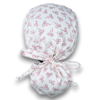 Pink Bows Ponytail scrub cap with satin lined. Bow Print surgical cap for women by Paradise Caps.