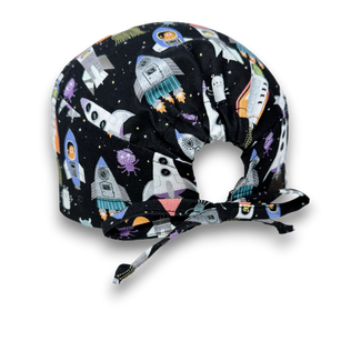Men's surgical scrub cap. Black Space Rocket Print skull tie-back style scrub hat by Paradise Caps.
