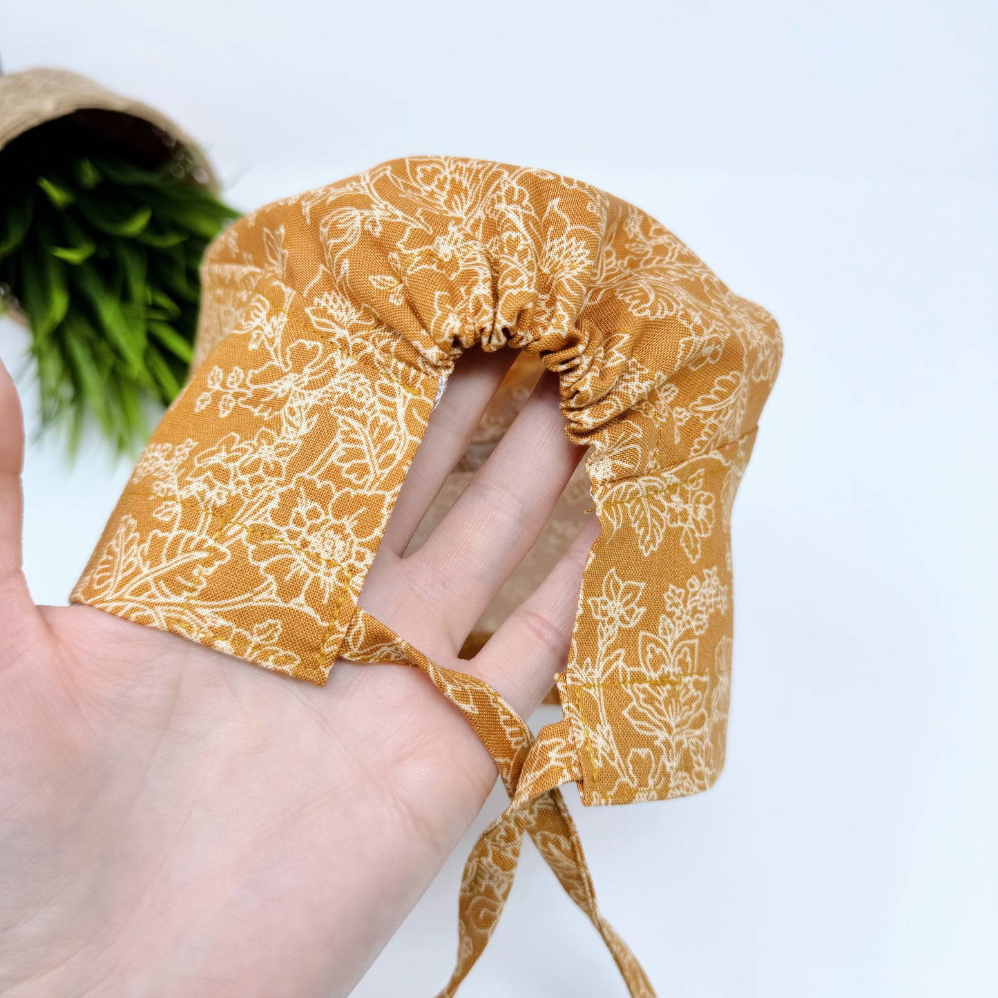 Flowers on mustard regular surgical cap. Scrub caps for women and men.