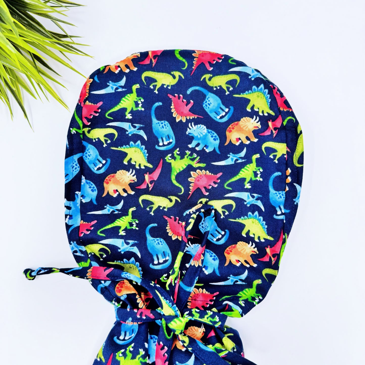 Fashion Dinosaurs Ponytail scrub cap, Surgical cap women. Satin Lined Option Surgical cap with ponytail.