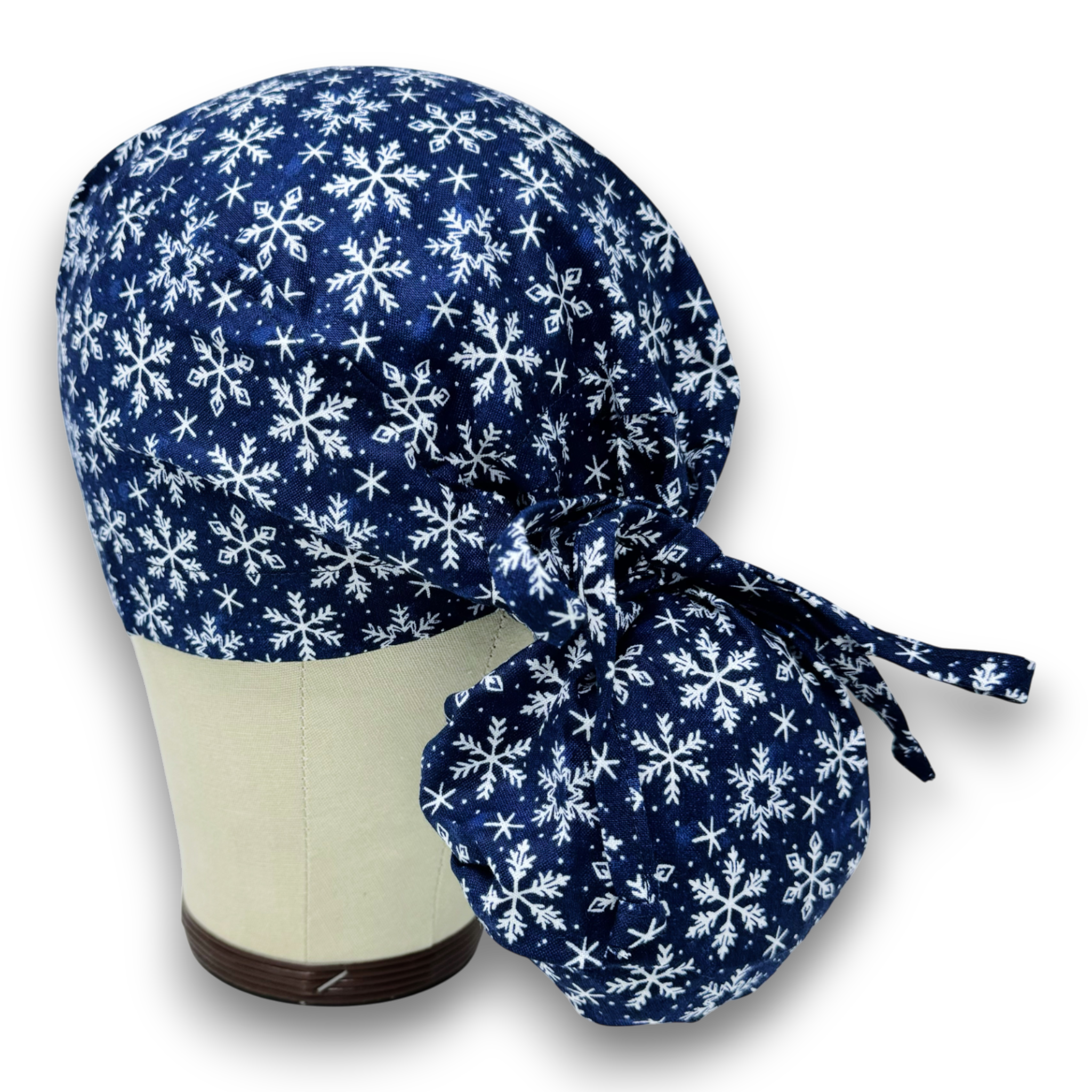 Snowflakes Ponytail scrub cap for women with satin lined option by Paradise Caps.