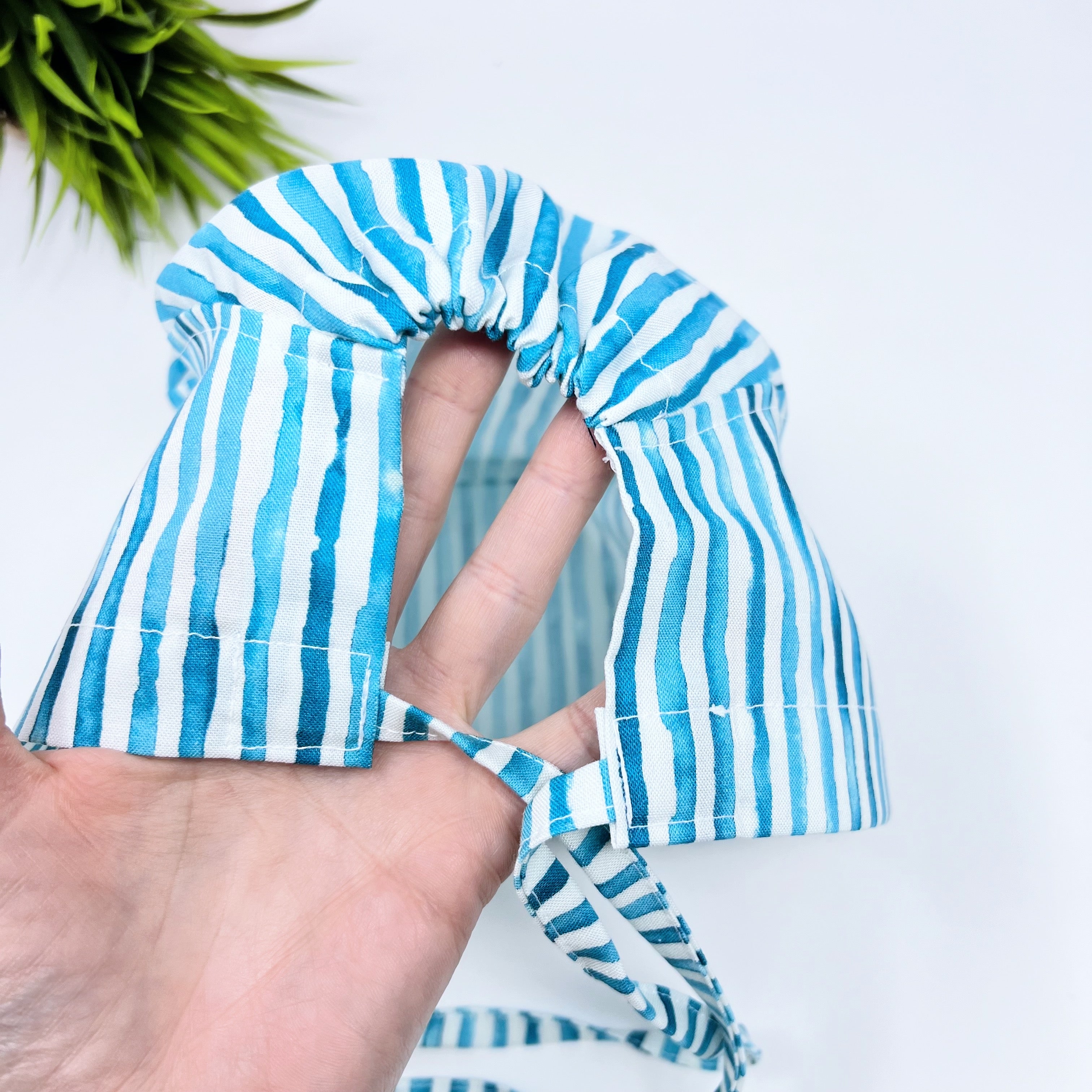 Blue Row Skull tie-back style surgical scrub cap by Paradise Caps.