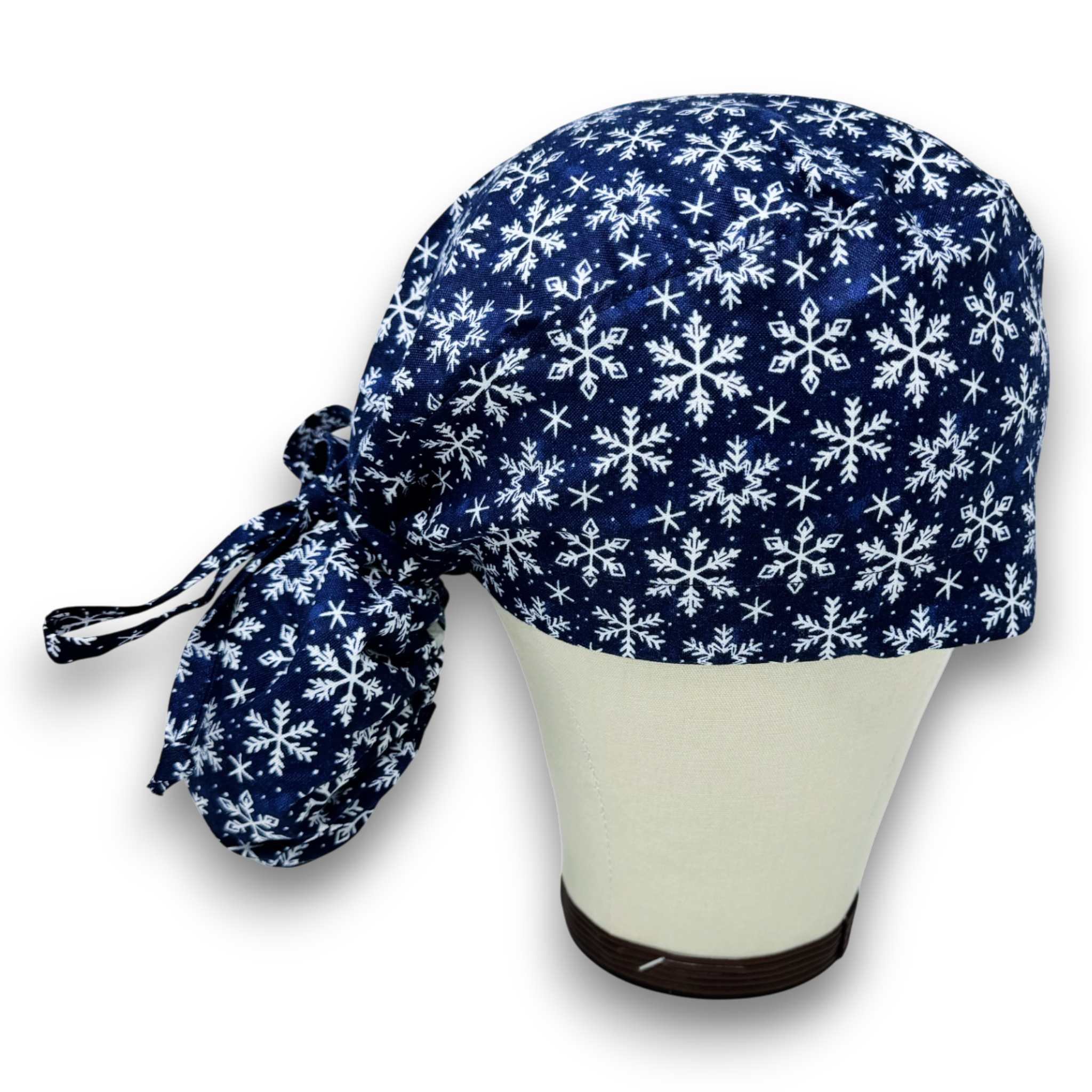 Snowflakes Ponytail scrub cap for women with satin lined option by Paradise Caps.