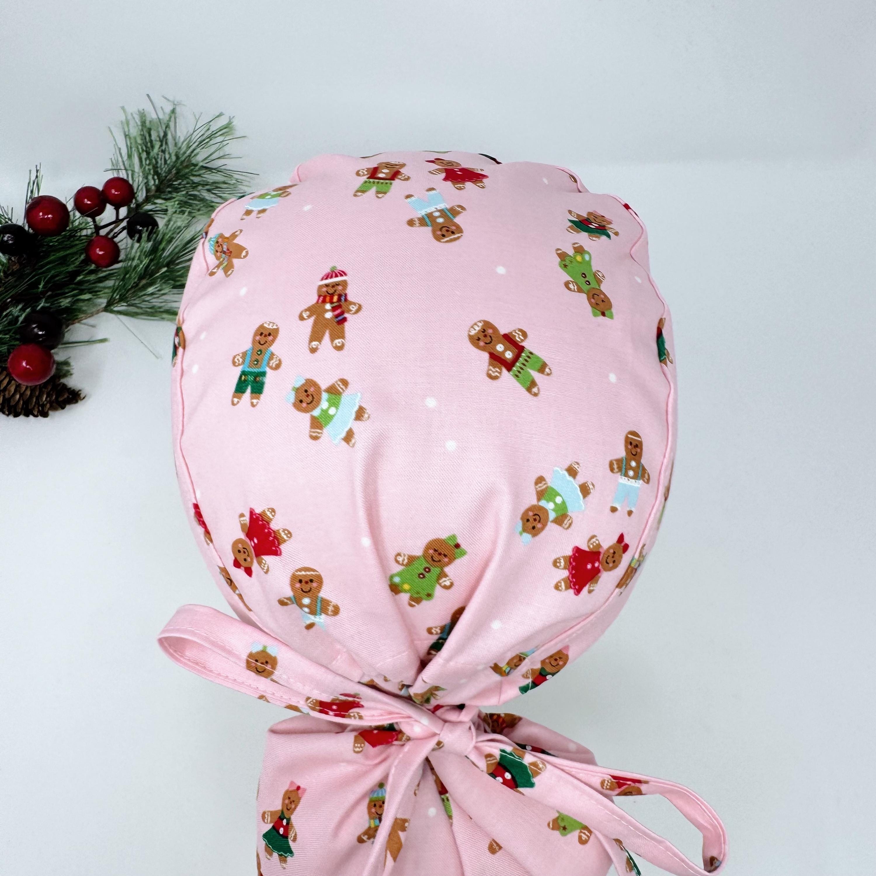 Gingerbread Ponytail scrub cap with Satin Lined. Cute Christmas surgical scrub hats for women by Paradise Caps. Pink