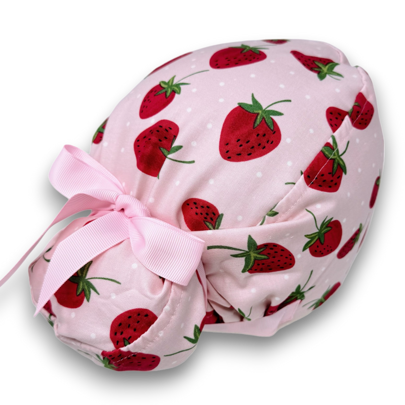 White strawberry-print Euro Plus scrub cap with pale pink ribbon ties