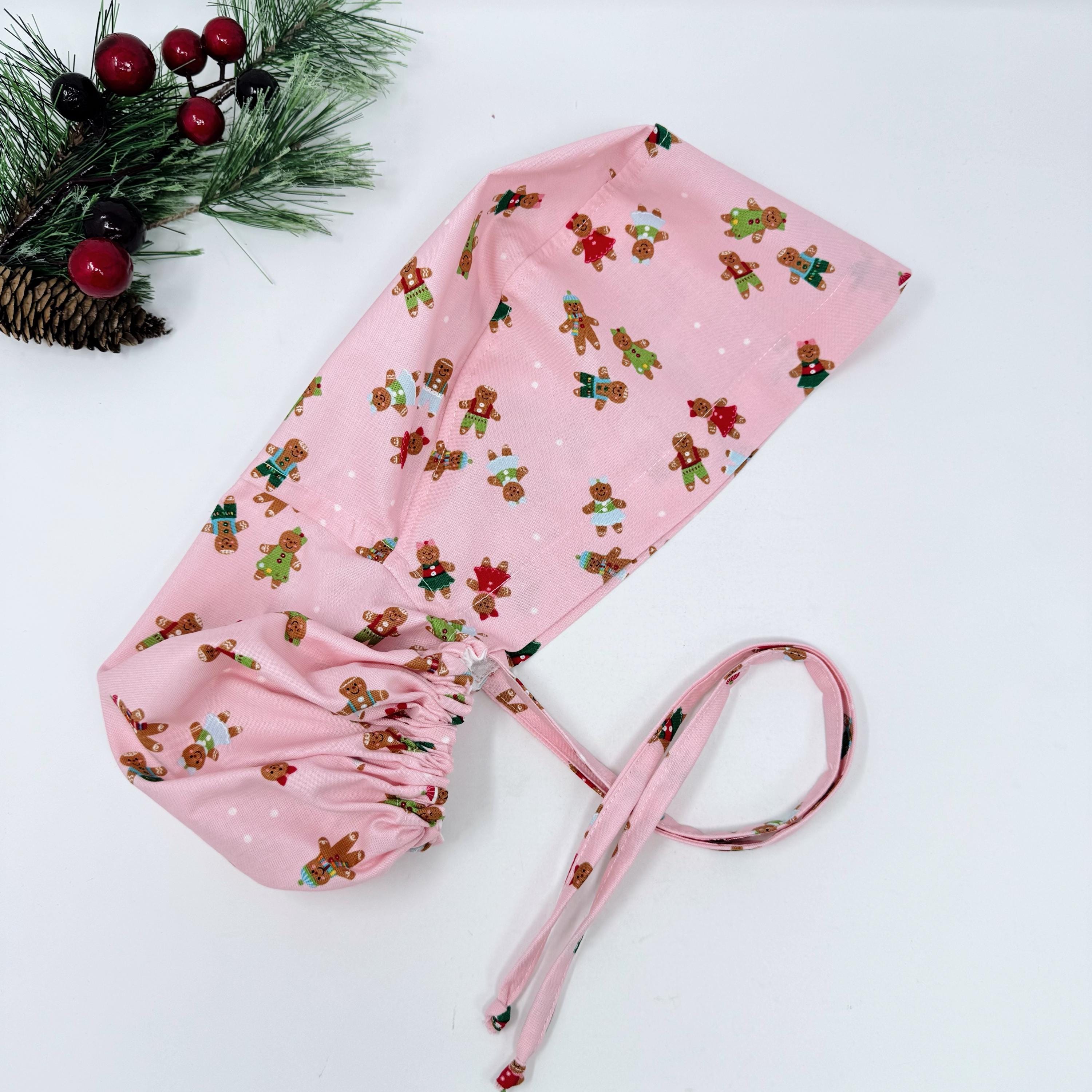 Gingerbread Ponytail scrub cap with Satin Lined. Cute Christmas surgical scrub hats for women by Paradise Caps. Pink