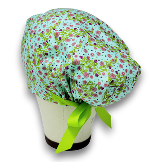 Pink flower Ponytail scrub cap for women with satin lined option by Paradise Caps.