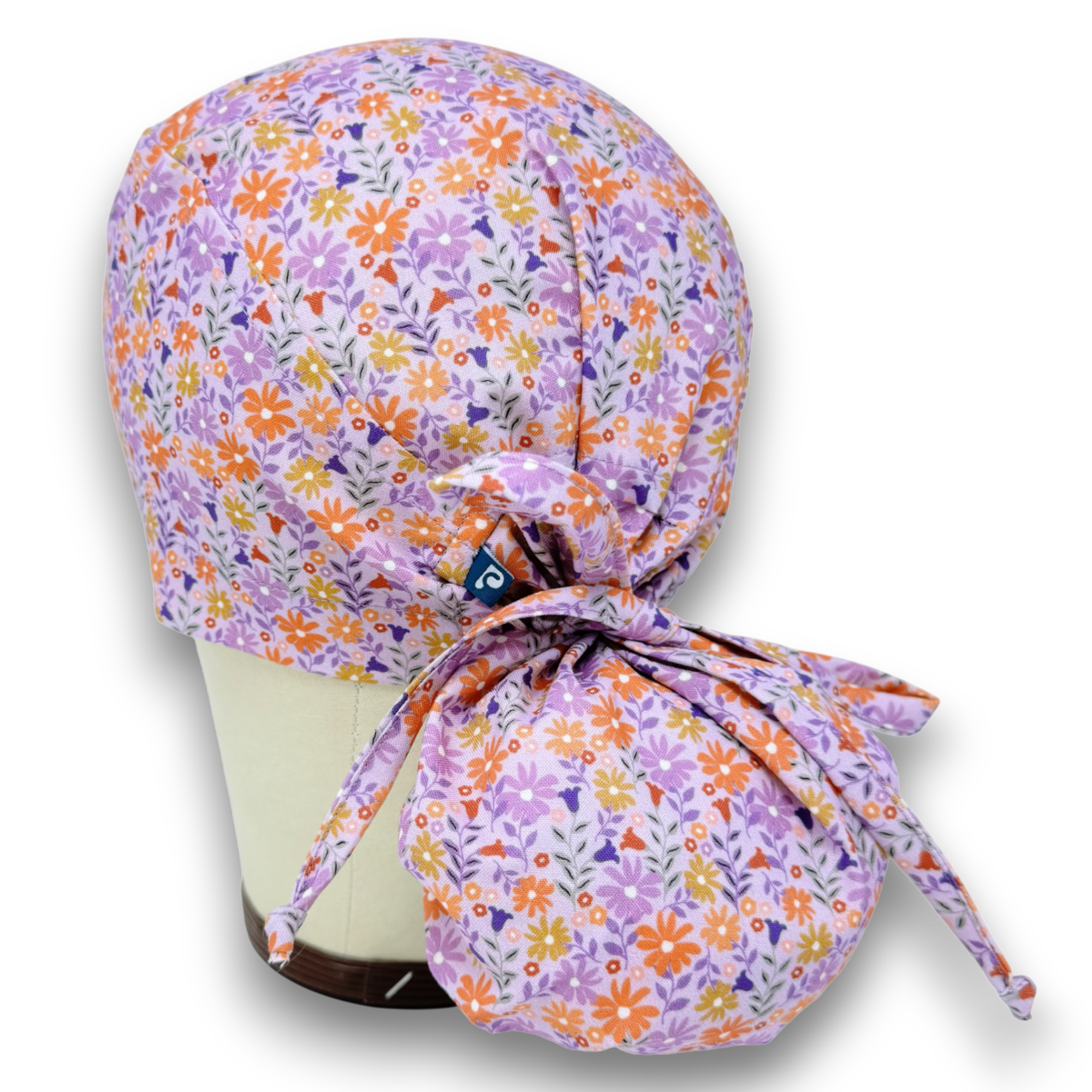 Purple Daisy Ponytail scrub cap for women. Flower Scrub hat for women with satin lined option by Paradise Caps.