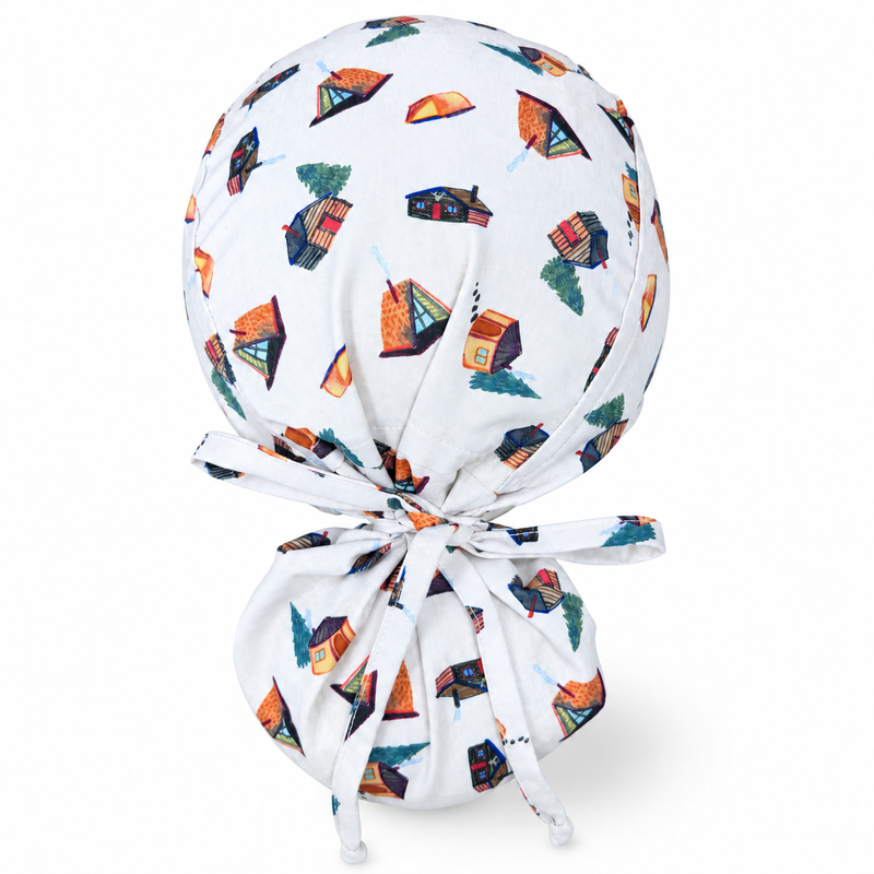 Cozy Cabins Ponytail scrub cap for women with satin lined option by Paradise Caps. on white background with soft shadow