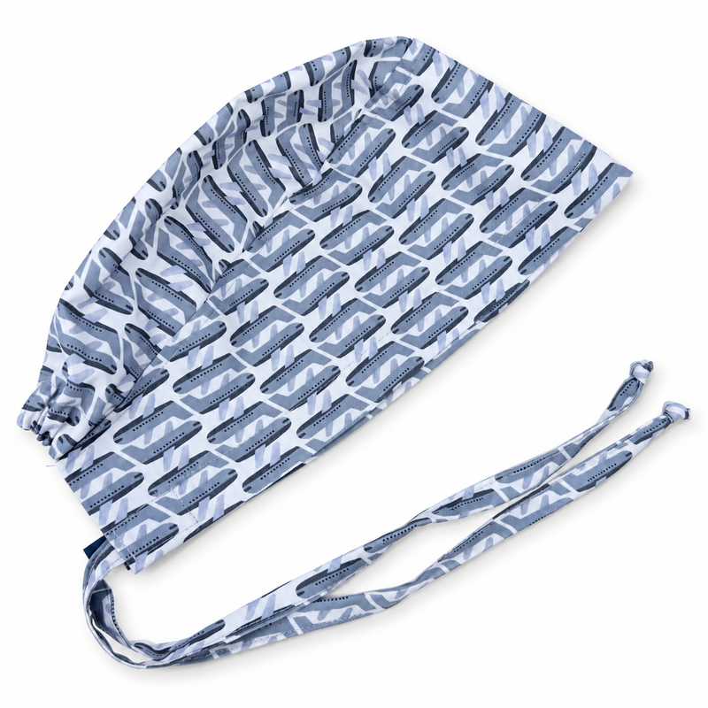 Gray Airplanes surgical scrub cap with soft shadow on white, mannequin-free close-up