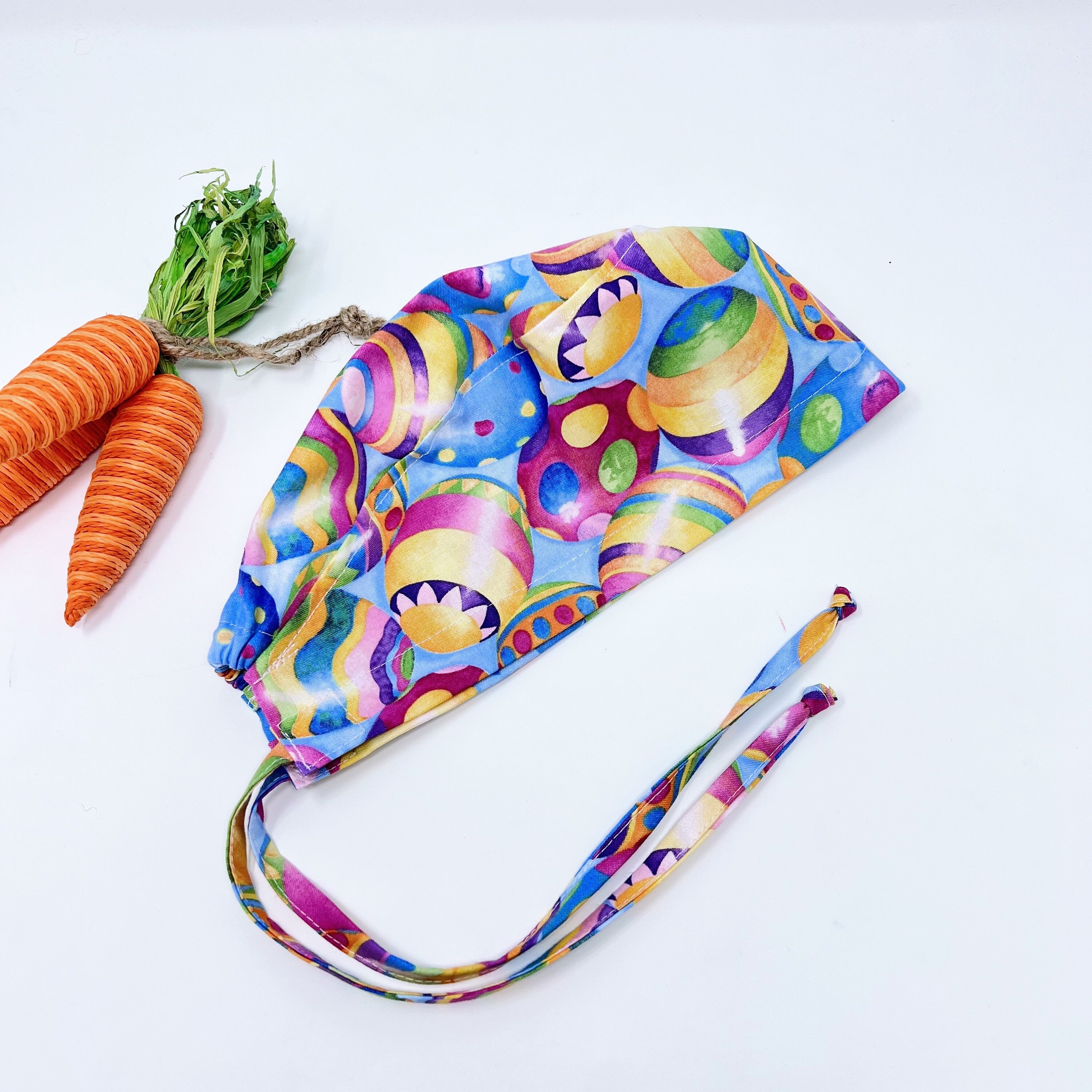 Easter Skull tie-back style surgical scrub cap. Egg surgical cap for women with satin lined option by Paradise Caps.
